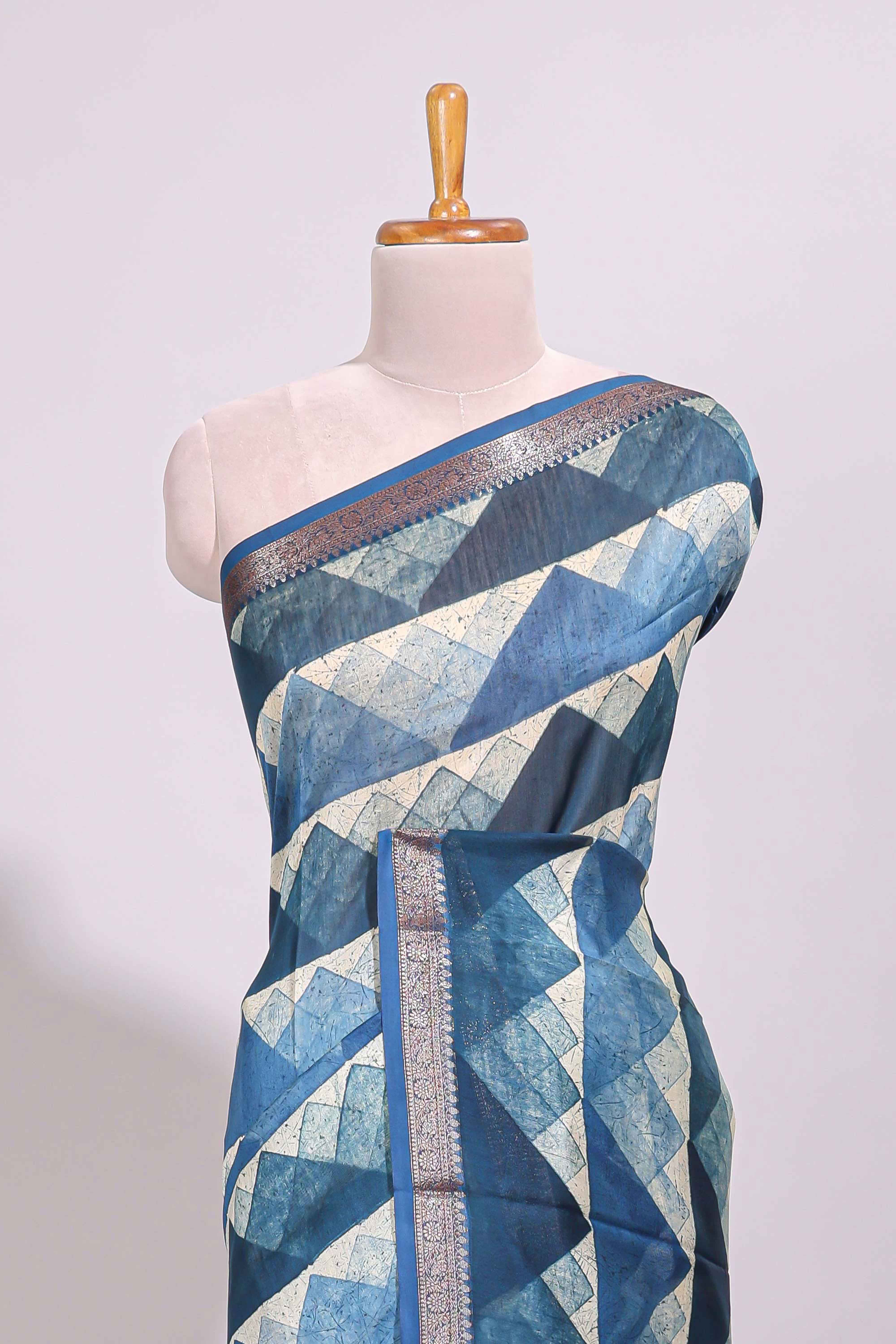 Cream geometric design chanderi cotton saree with contrast border and printed blouse