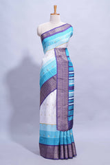 White and Aqua Blue Dola Silk Saree with rich zari border woven butis and a designer pallu along with contrast blouse