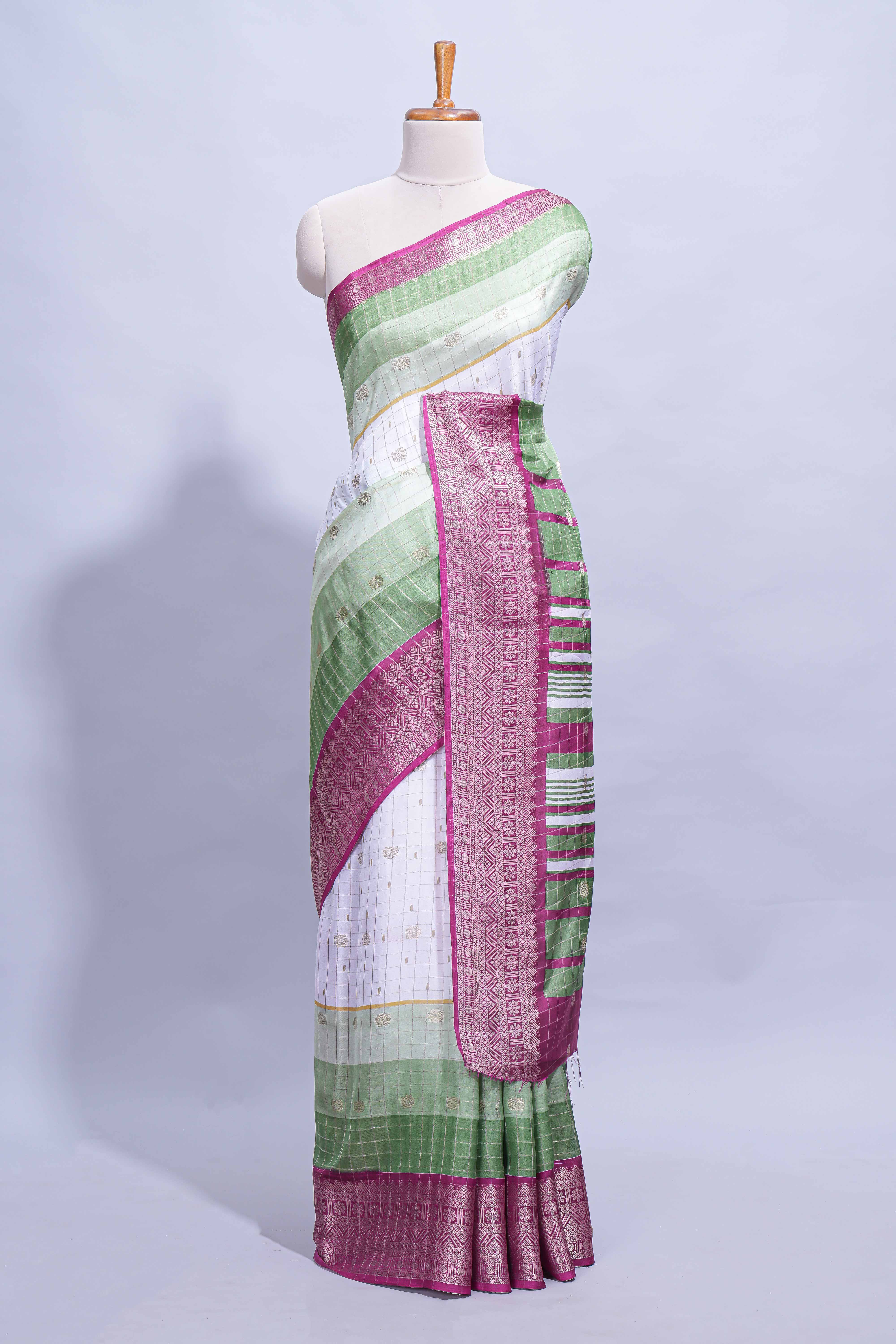 White and green Dola Silk Saree with rich zari border woven butis and a designer pallu along with contrast blouse