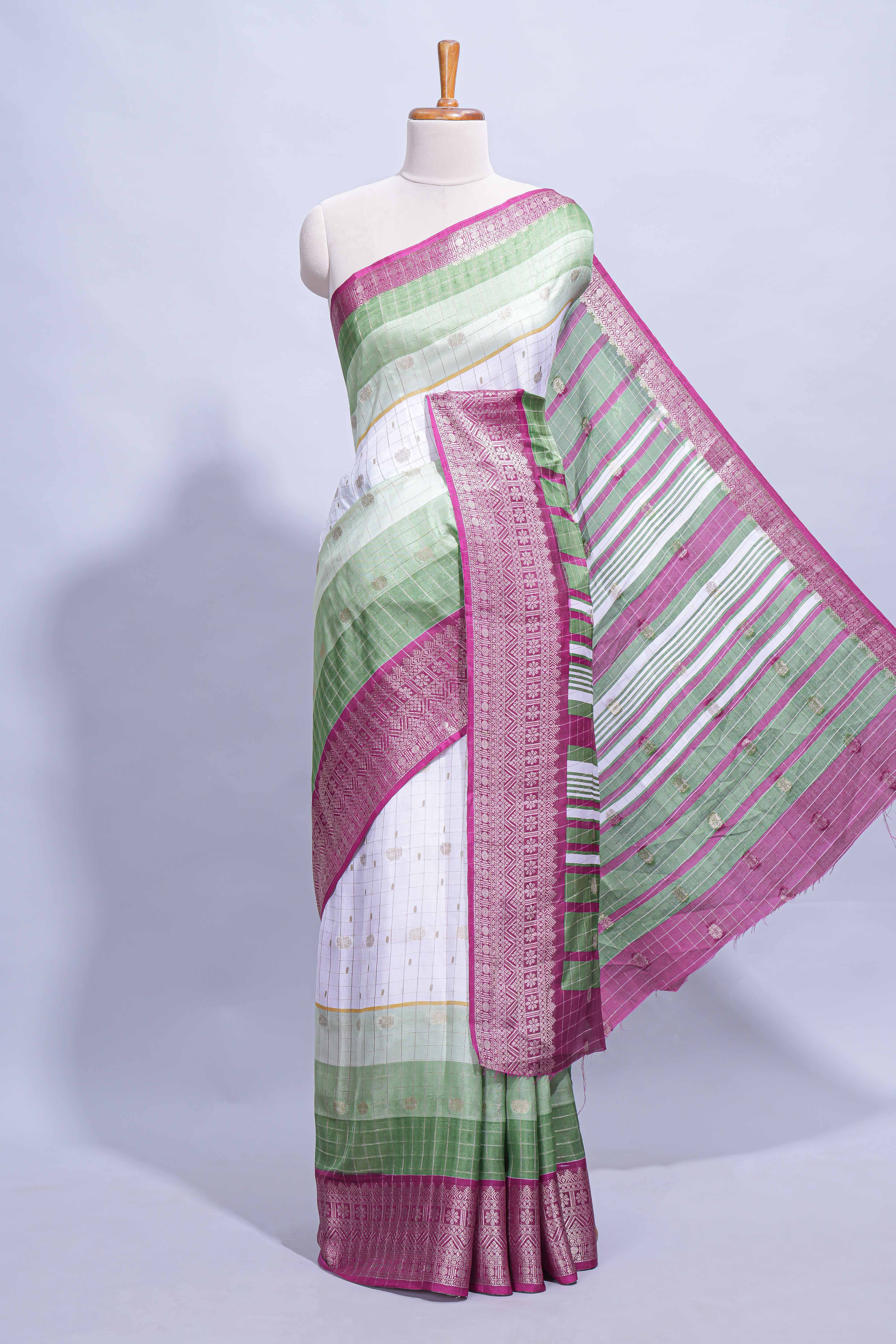 White and green Dola Silk Saree with rich zari border woven butis and a designer pallu along with contrast blouse