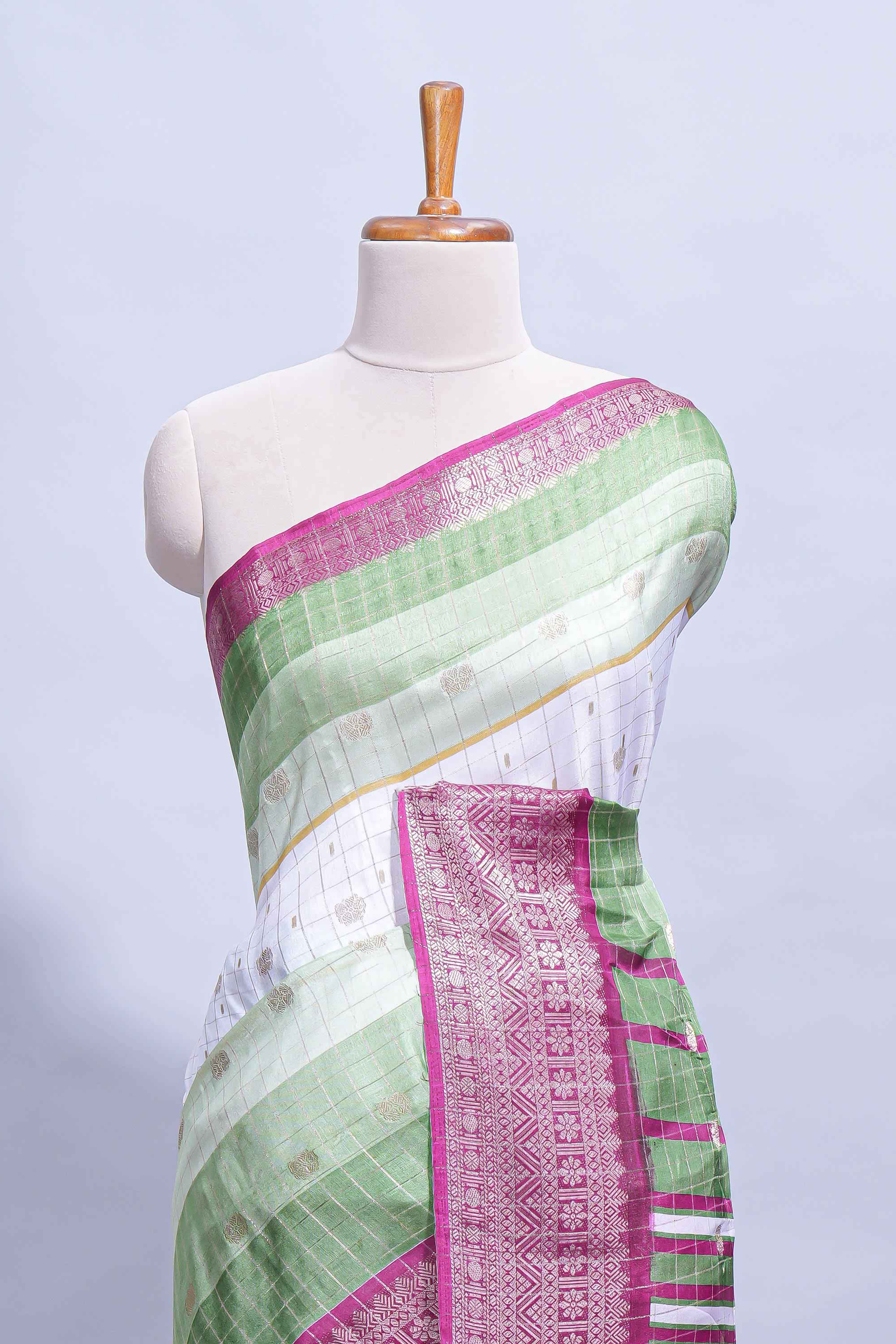 White and green Dola Silk Saree with rich zari border woven butis and a designer pallu along with contrast blouse