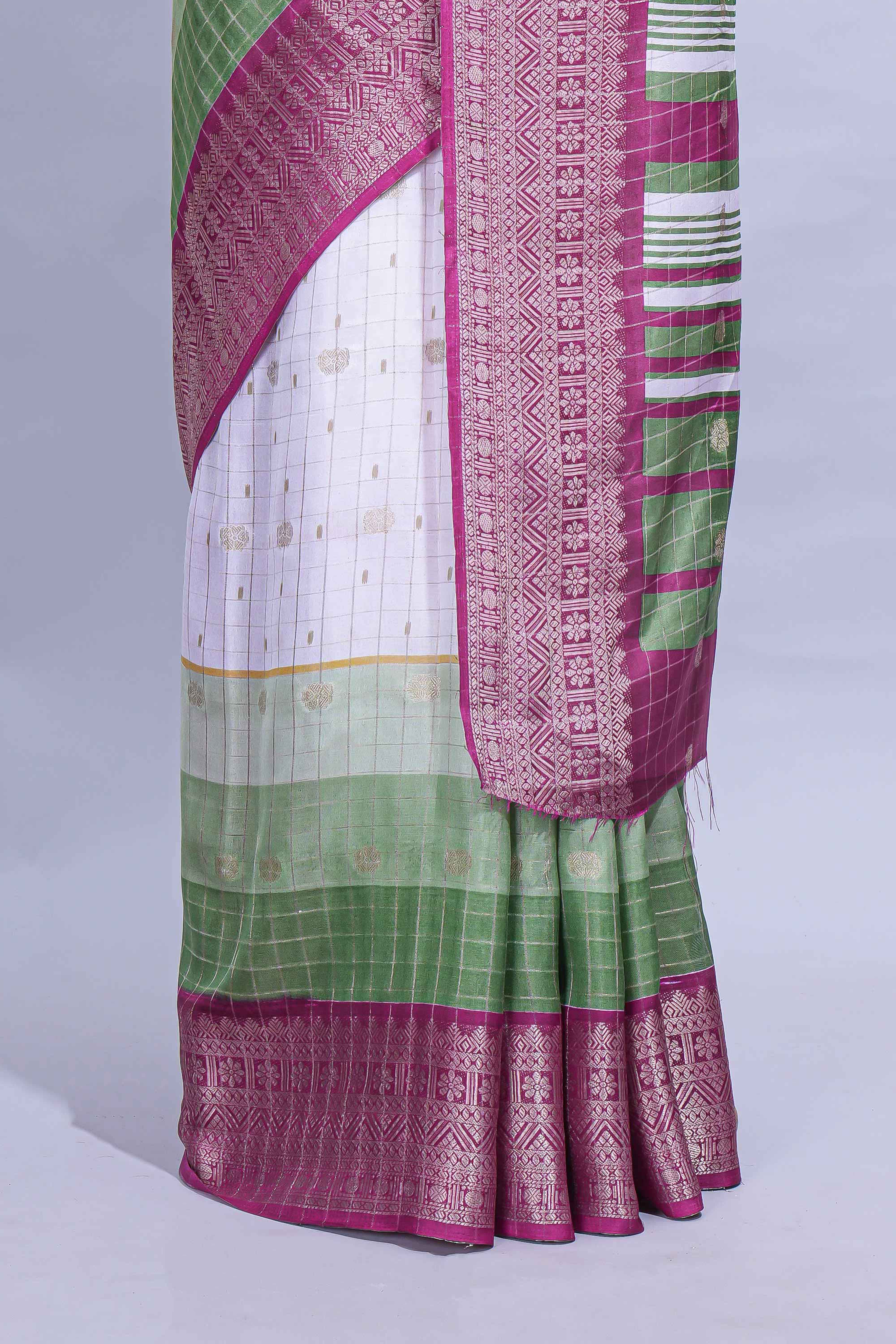 White and green Dola Silk Saree with rich zari border woven butis and a designer pallu along with contrast blouse
