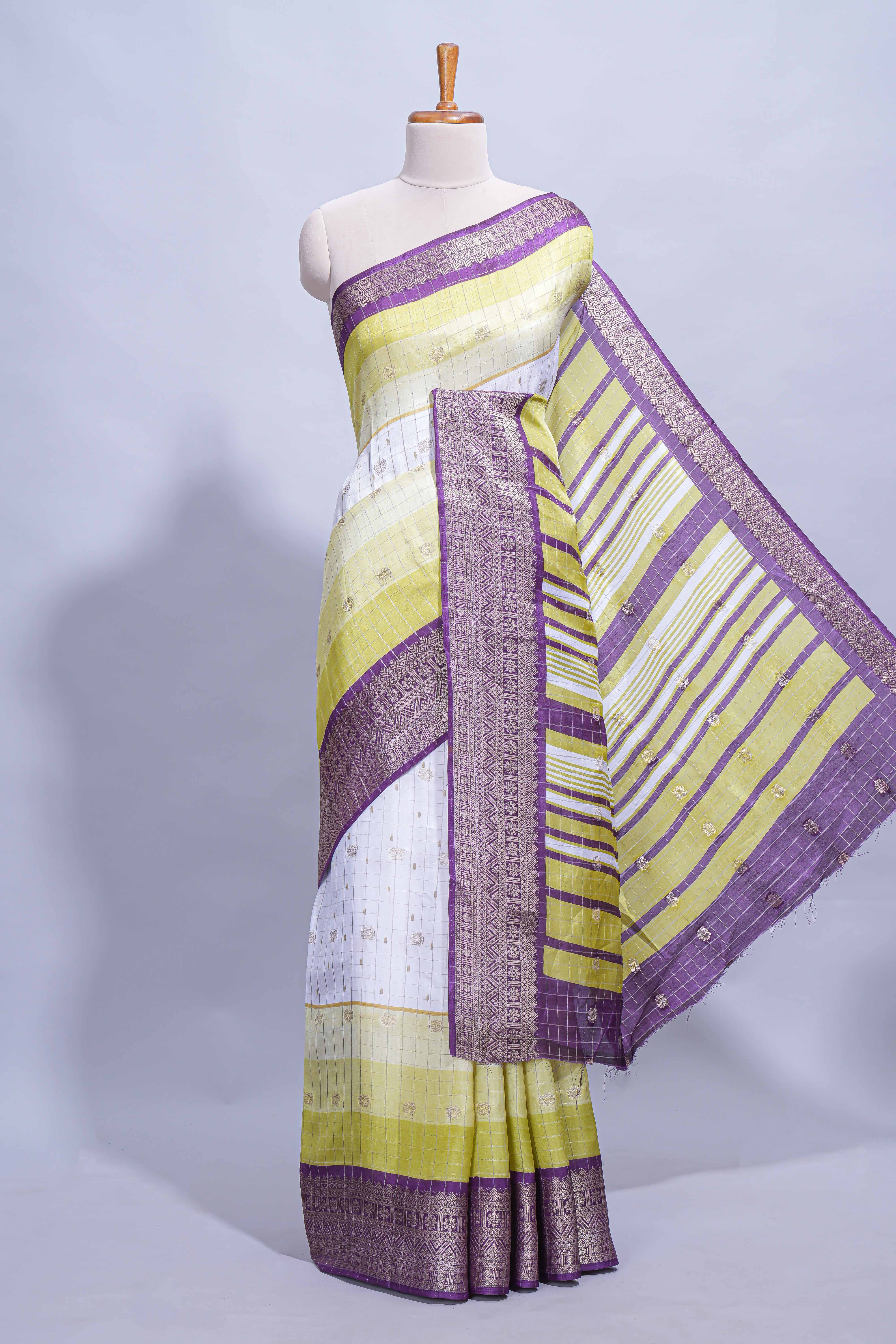 White and yellow Dola Silk Saree with rich zari border woven butis and a designer pallu along with contrast blouse