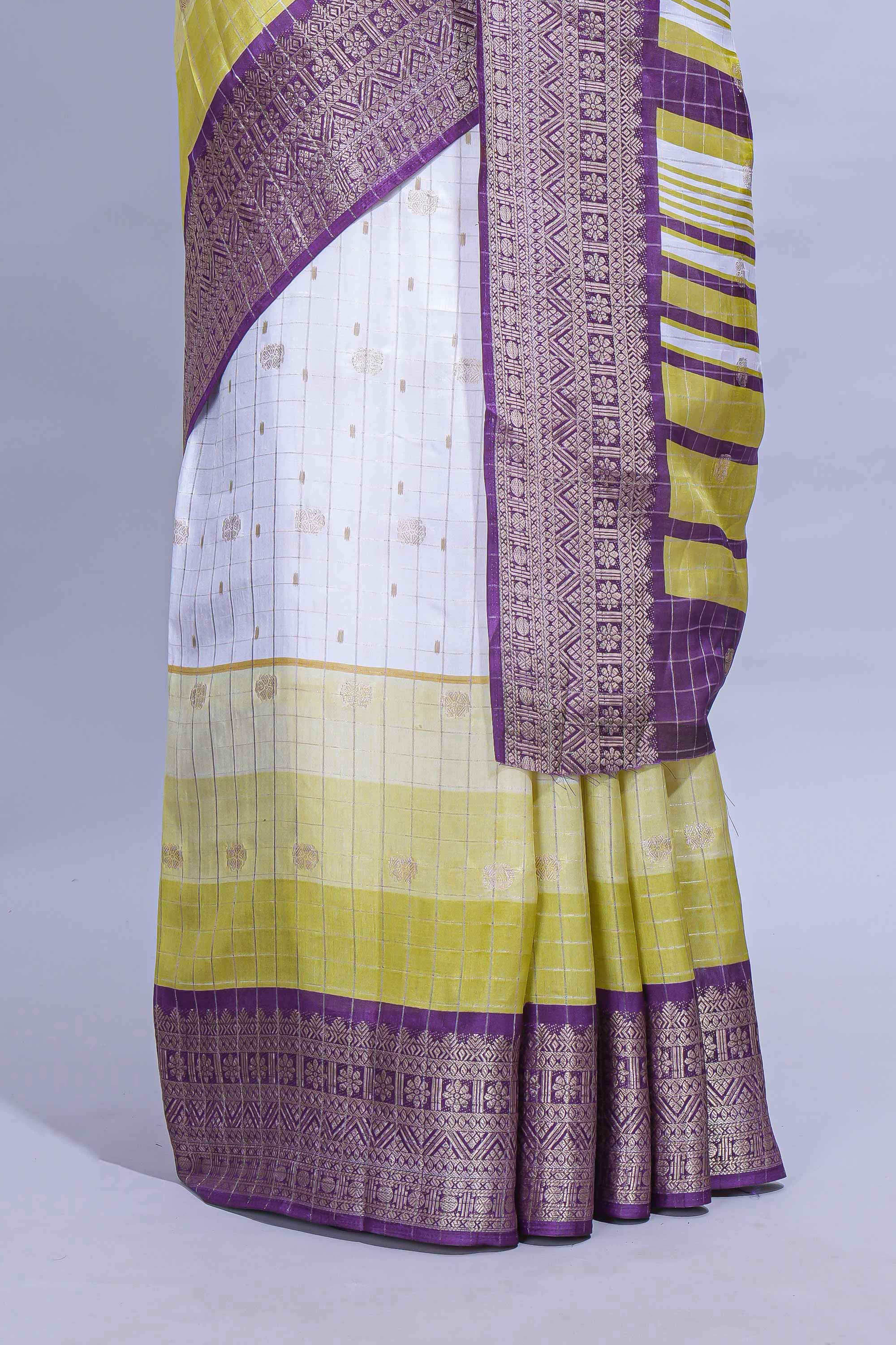 White and yellow Dola Silk Saree with rich zari border woven butis and a designer pallu along with contrast blouse