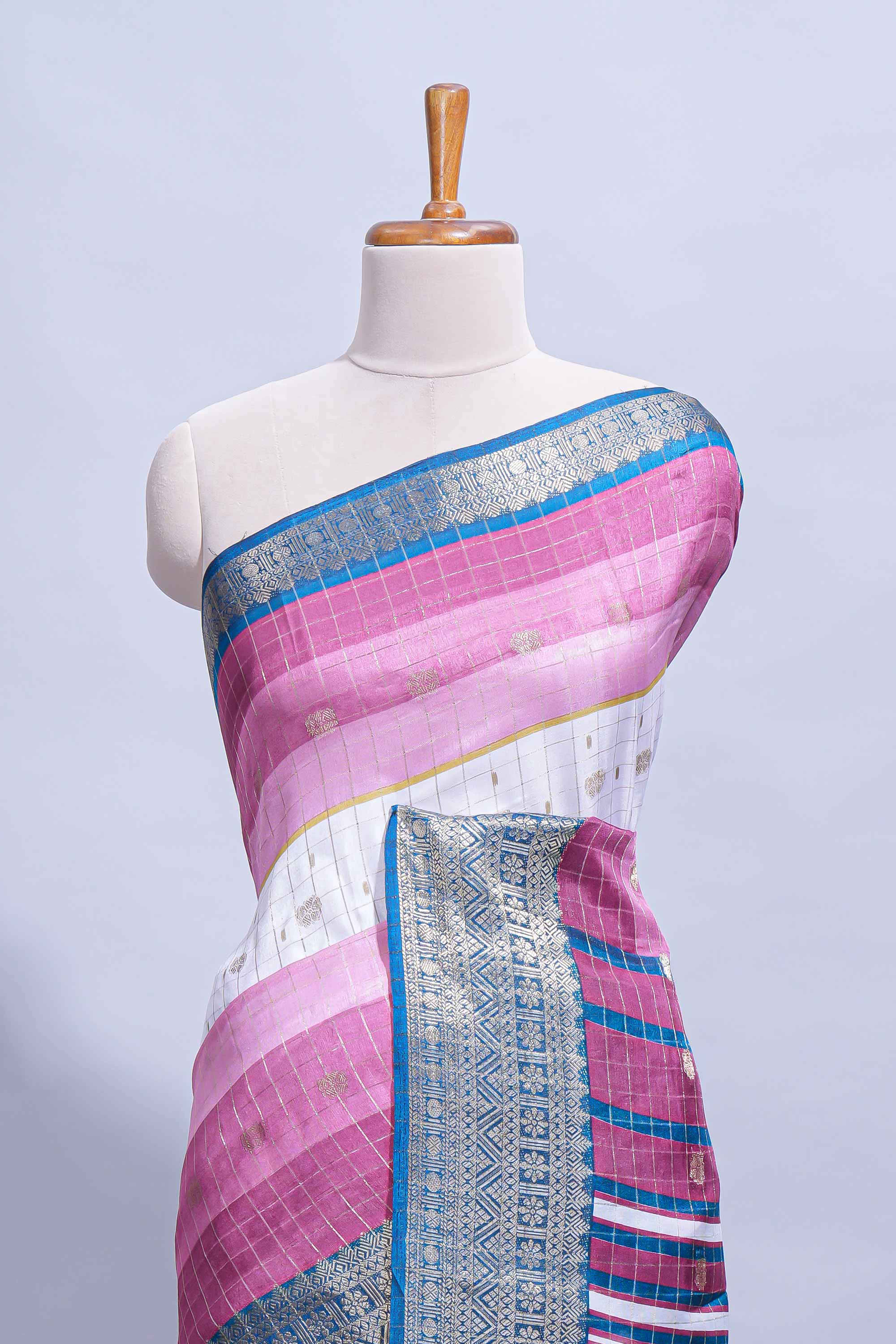 White and violet Dola Silk Saree with rich zari border woven butis and a designer pallu along with contrast blouse