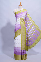 White and purple Dola Silk Saree with rich zari border woven butis and a designer pallu along with contrast blouse