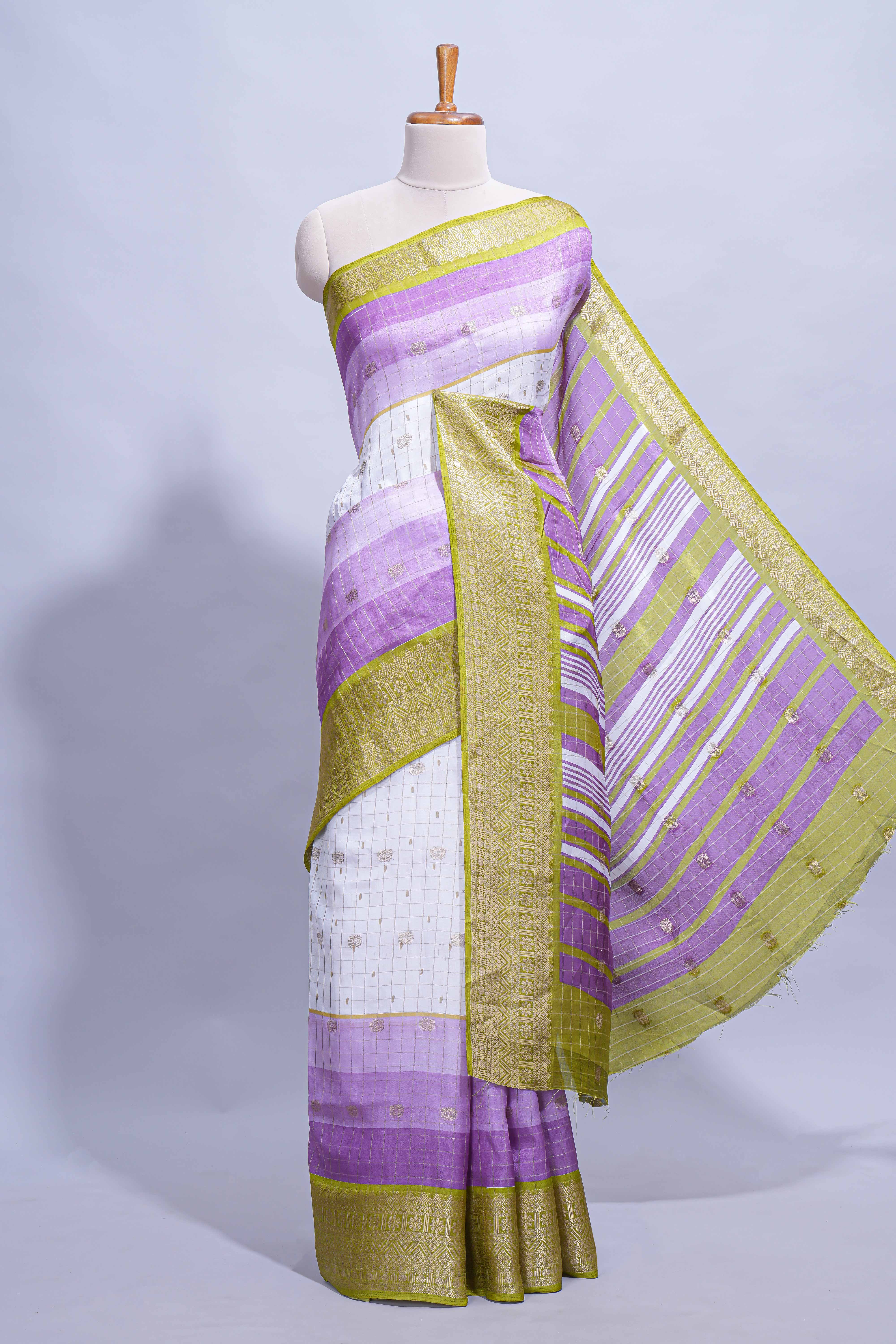 White and purple Dola Silk Saree with rich zari border woven butis and a designer pallu along with contrast blouse