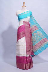 White Dola Silk Saree with aqua blue and magenta zari borders elegant woven checks and a rich designer pallu along with contrast blouse