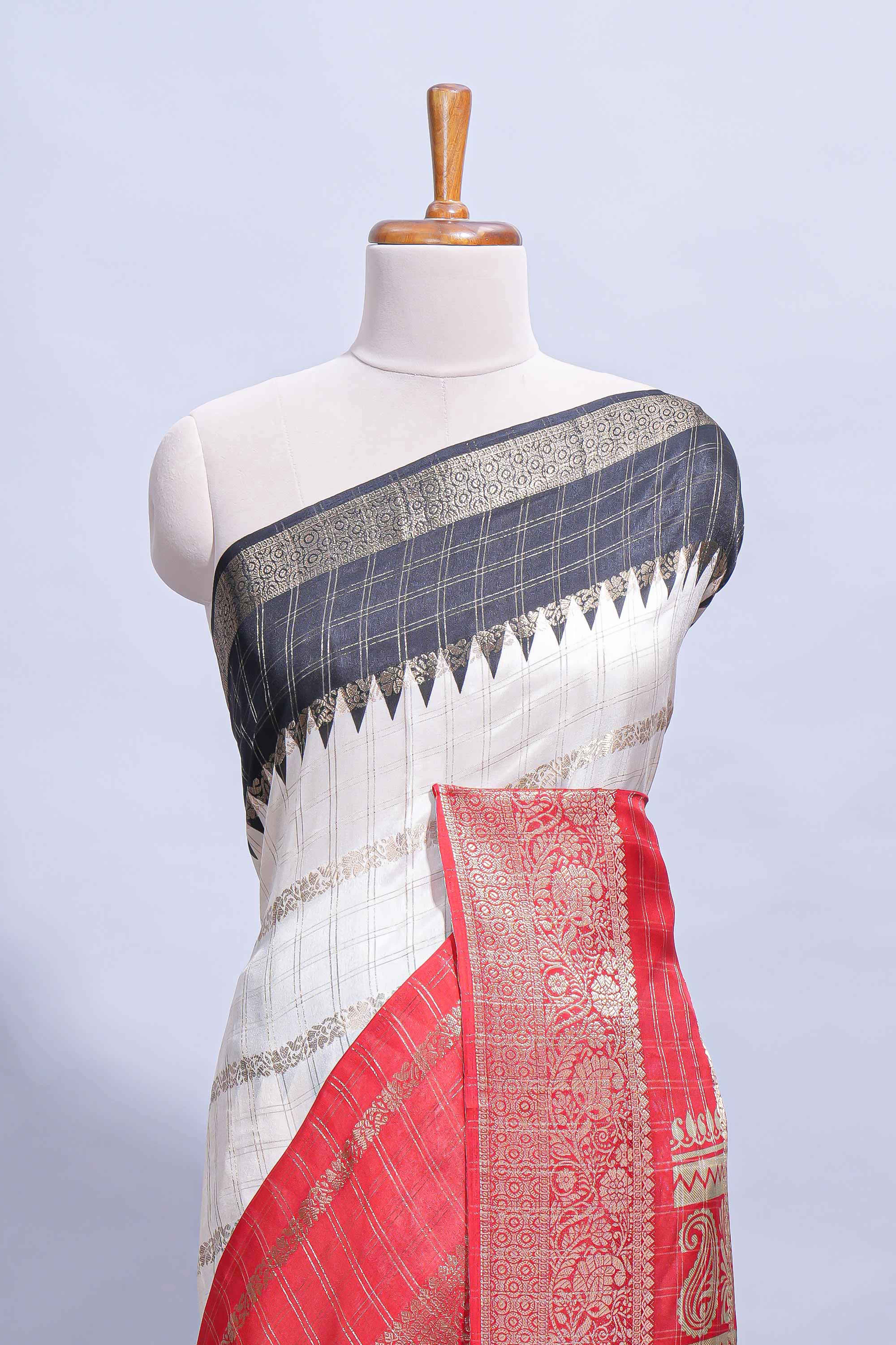 White Dola Silk Saree with red and black zari borders elegant woven checks and a rich designer pallu along with contrast blouse