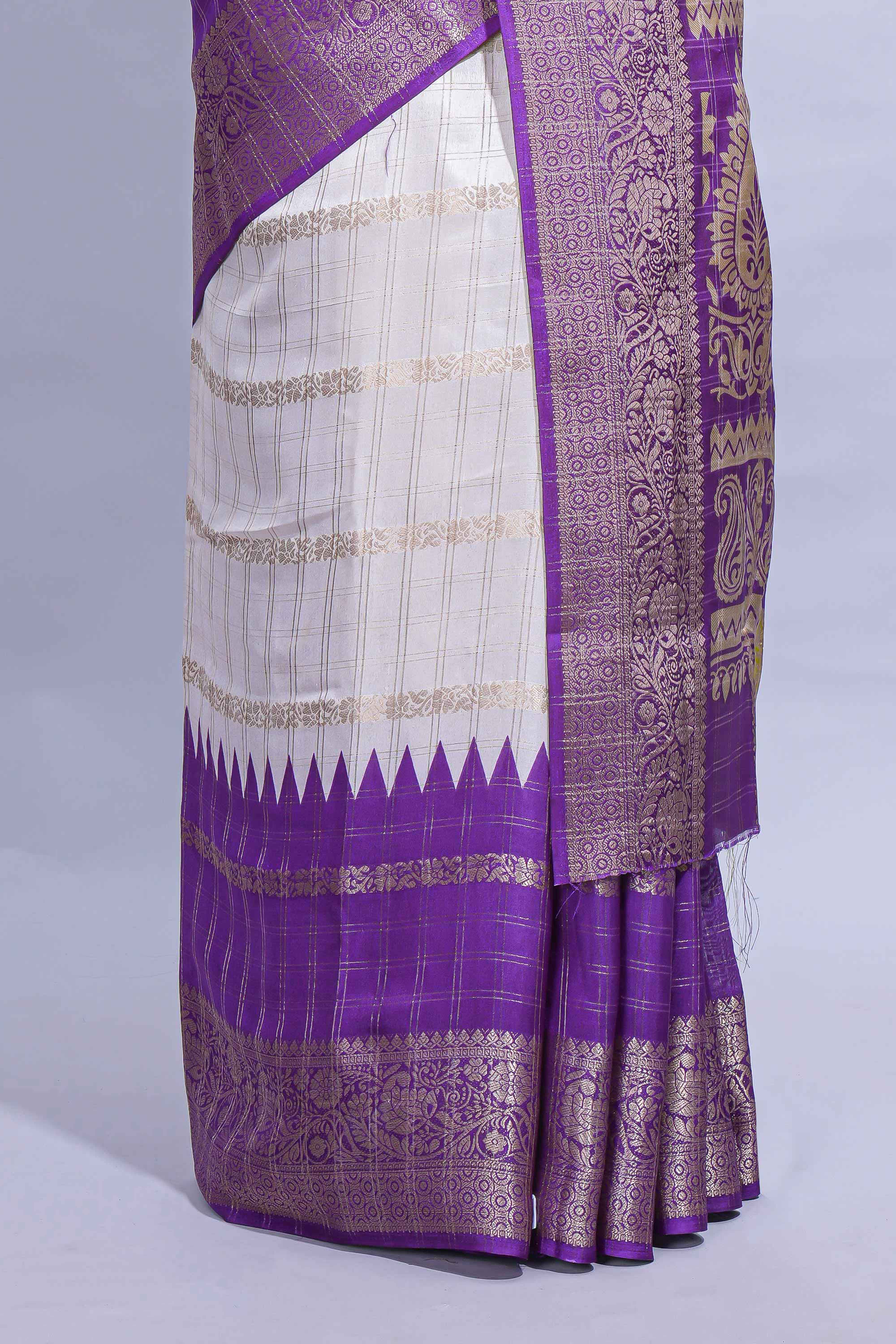 White Dola Silk Saree with violet and green zari borders elegant woven checks and a rich designer pallu along with contrast blouse