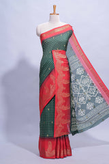 Dark Green Dola Silk Saree with elegant zari butis a rich zari border woven designer pallu along with matcing blouse