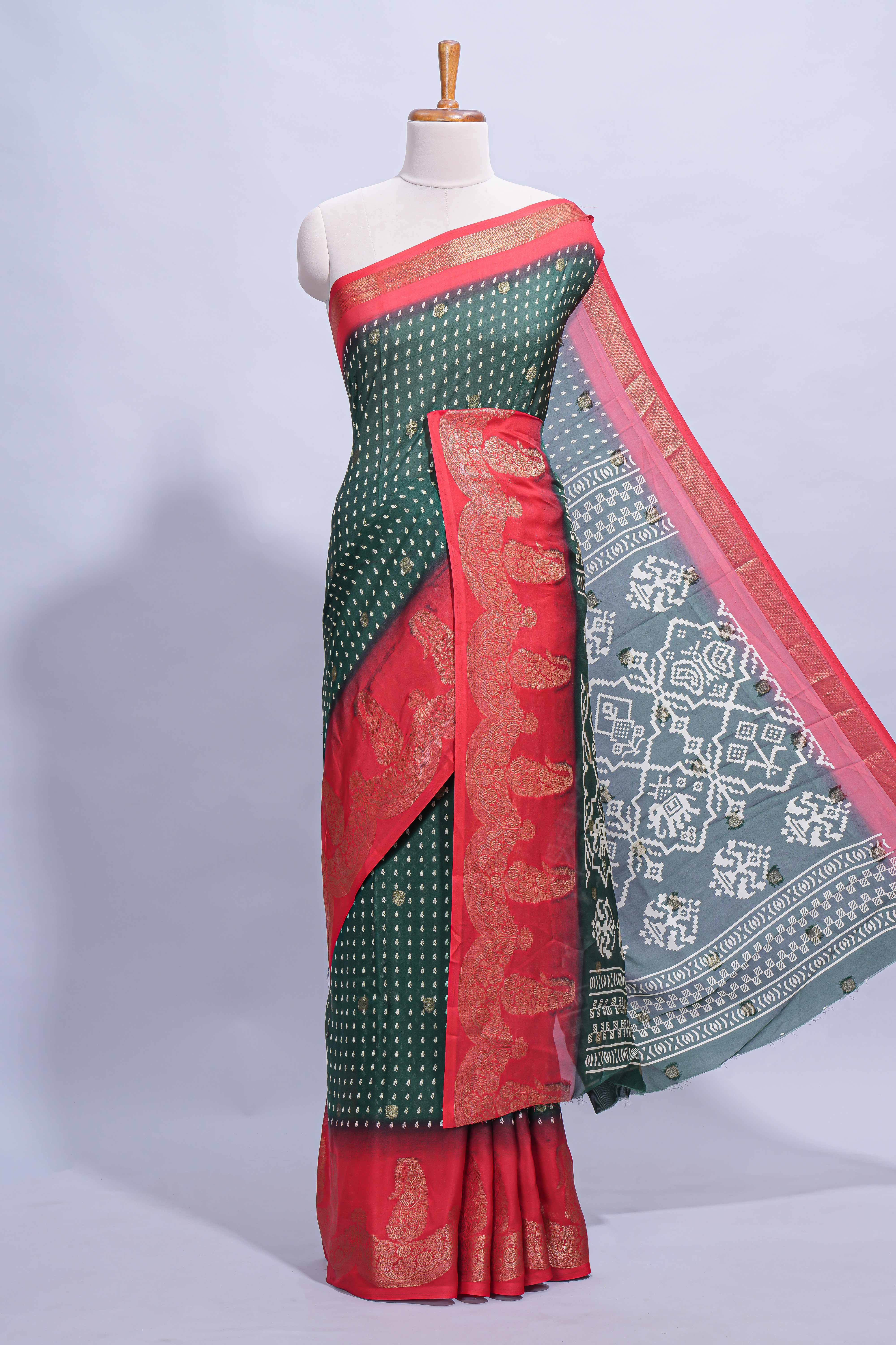 Dark Green Dola Silk Saree with elegant zari butis a rich zari border woven designer pallu along with matcing blouse