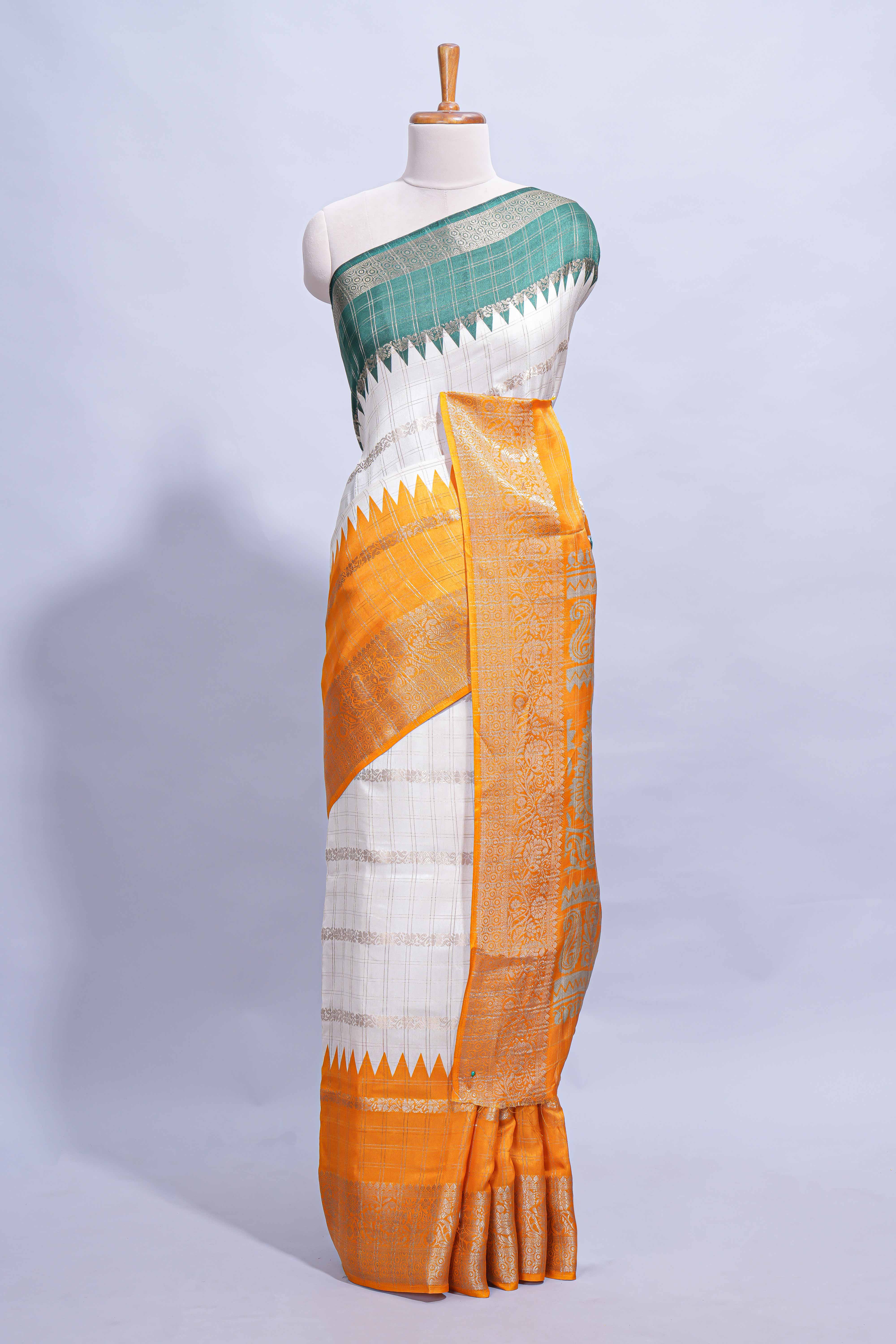 White Dola Silk Saree with orange and green zari borders elegant woven checks and a rich designer pallu along with contrast blouse