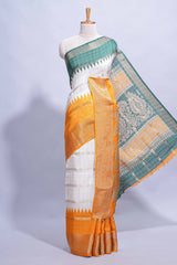 White Dola Silk Saree with orange and green zari borders elegant woven checks and a rich designer pallu along with contrast blouse