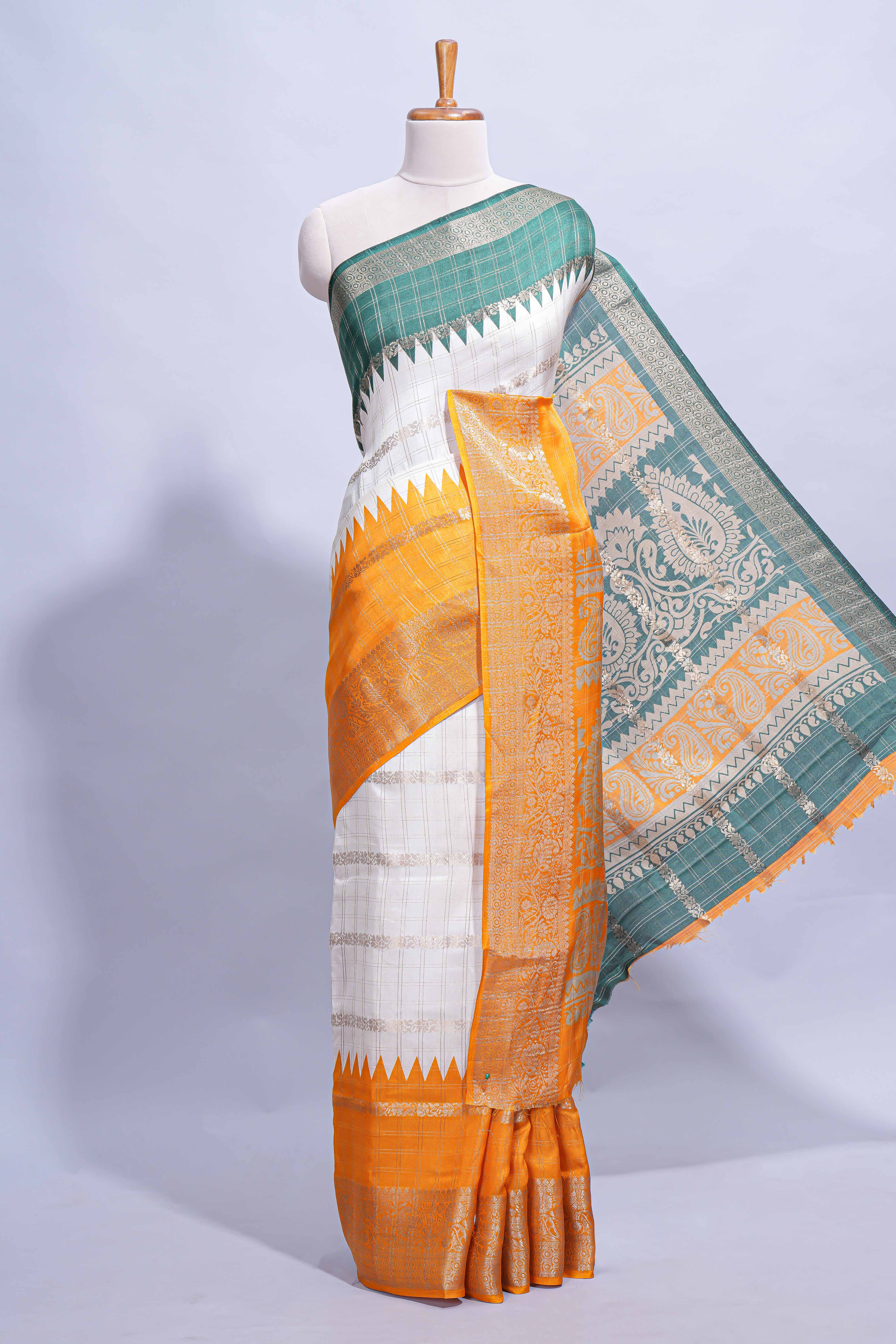 White Dola Silk Saree with orange and green zari borders elegant woven checks and a rich designer pallu along with contrast blouse