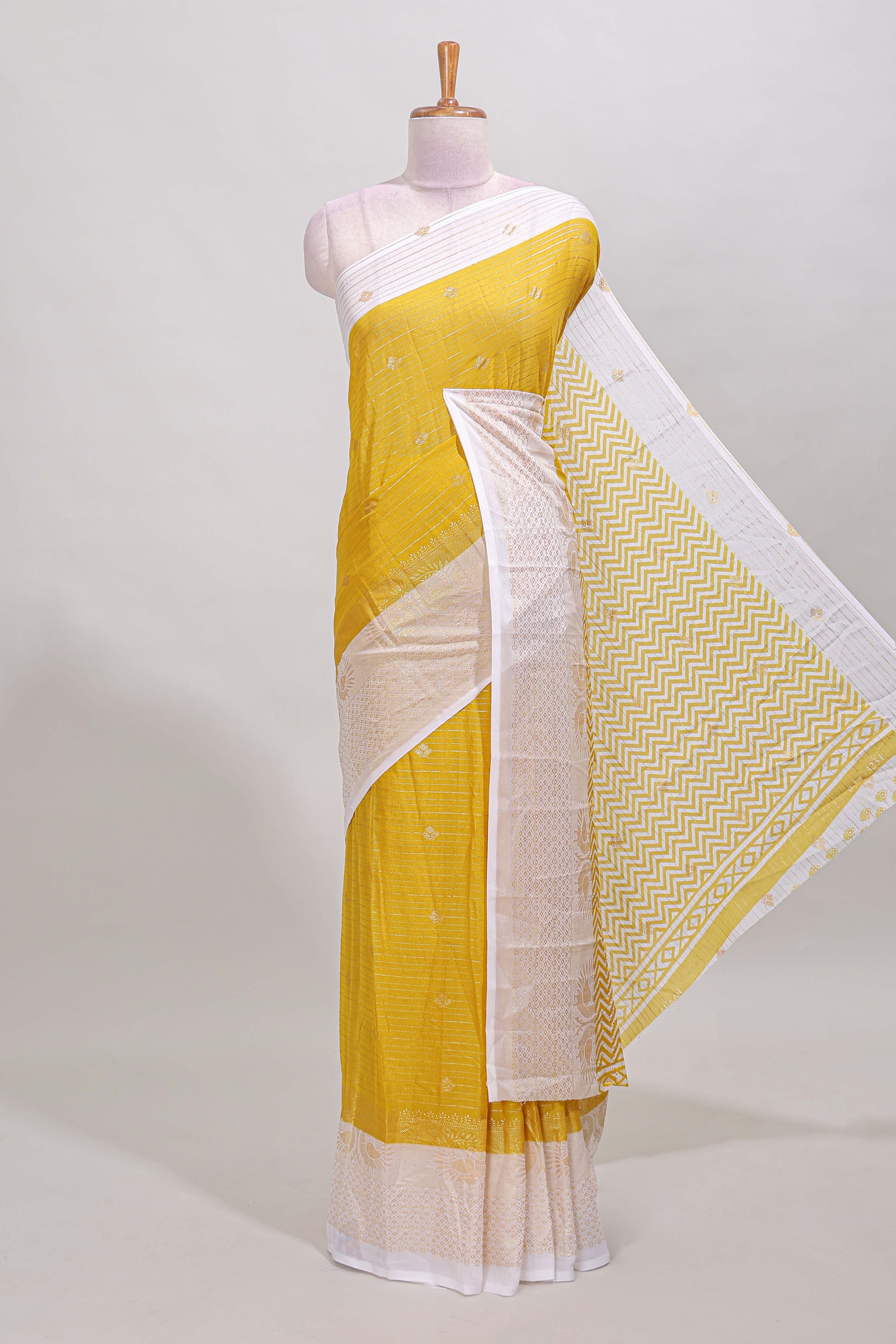 Yellow striped zari butta dola silk saree with contrast zari border and matching blouse