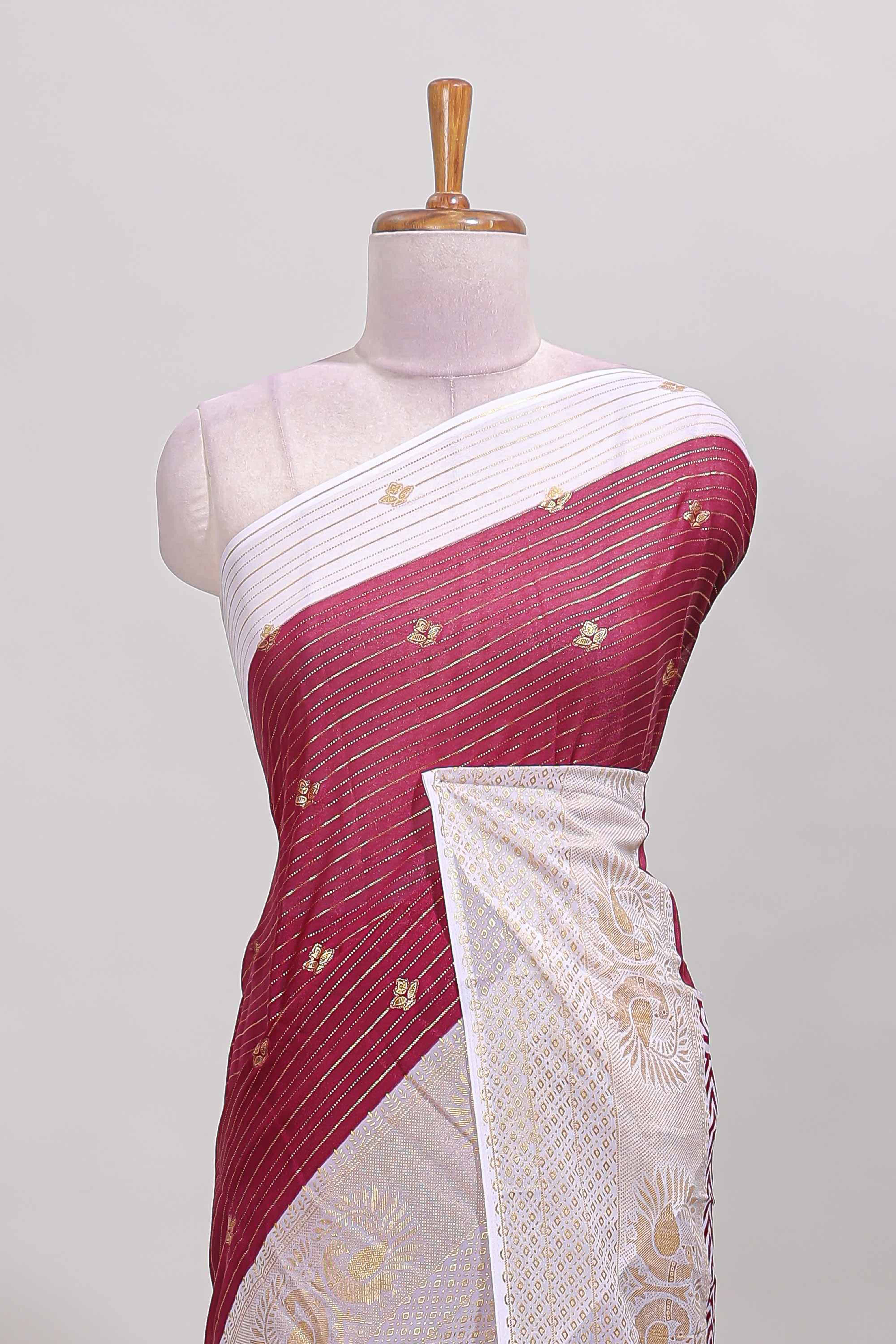 Maroon zari striped dola silk saree with contrast zari border and blouse