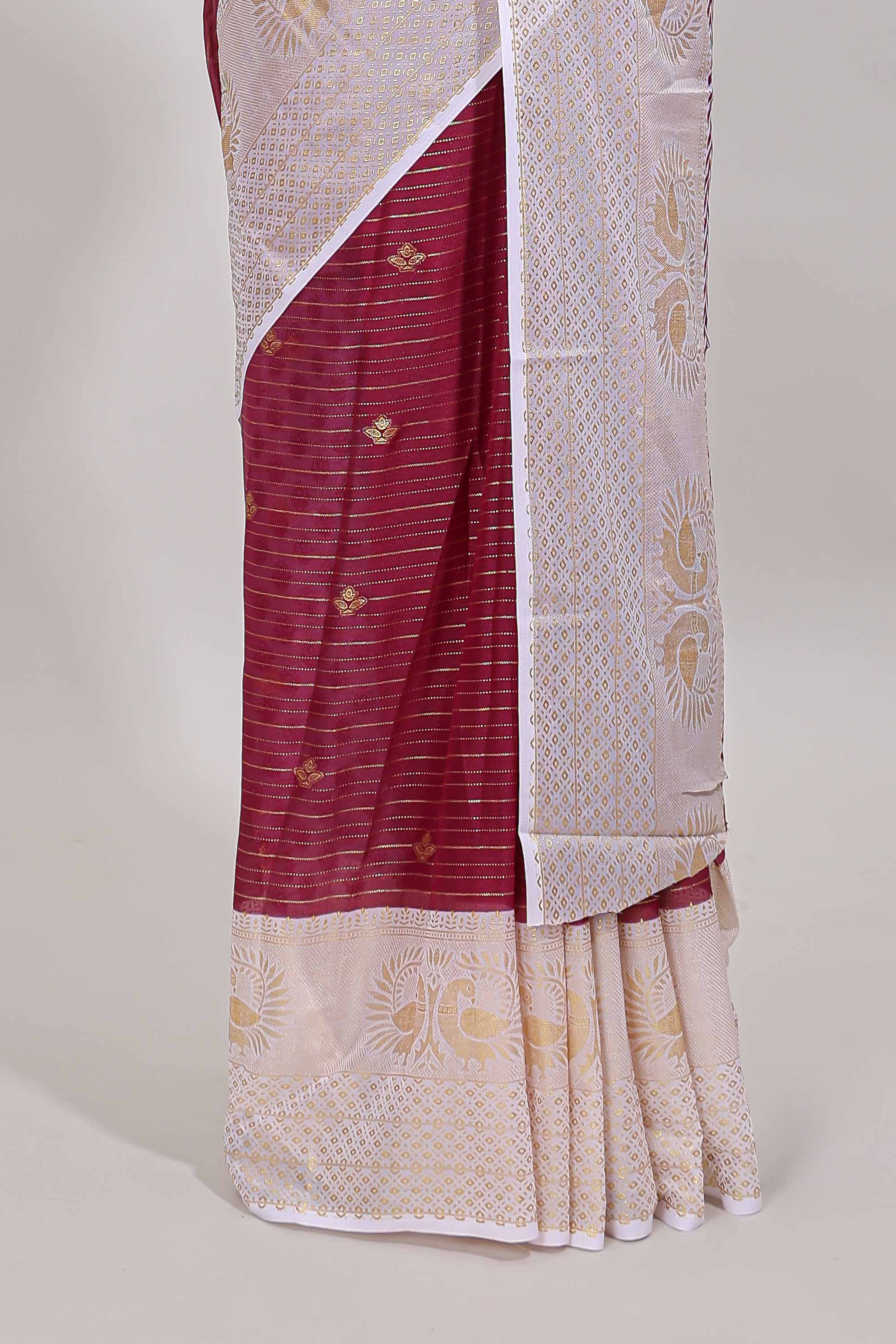 Maroon zari striped dola silk saree with contrast zari border and blouse