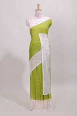 Green zari striped dola silk saree with contrast zari border and blouse