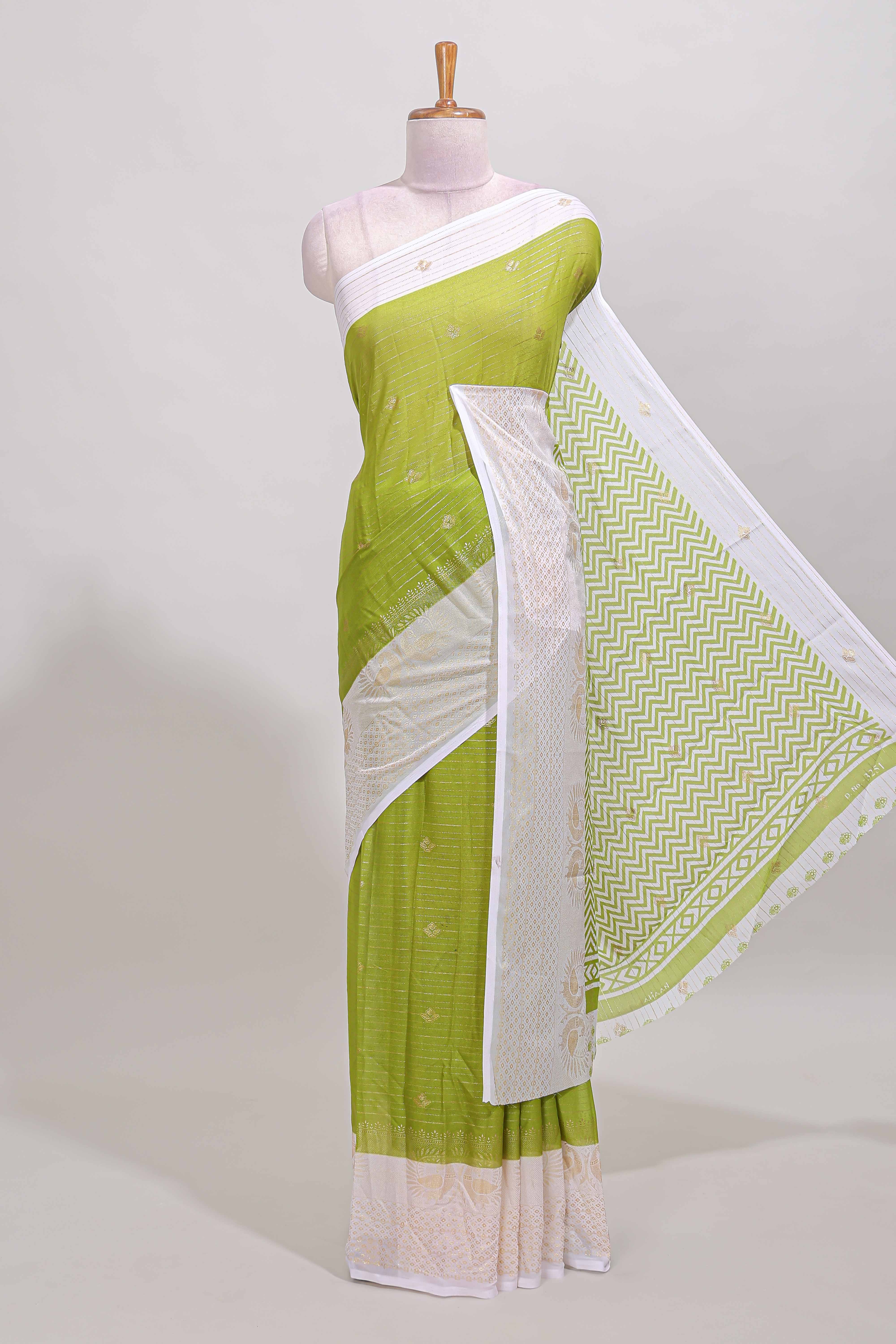 Green zari striped dola silk saree with contrast zari border and blouse