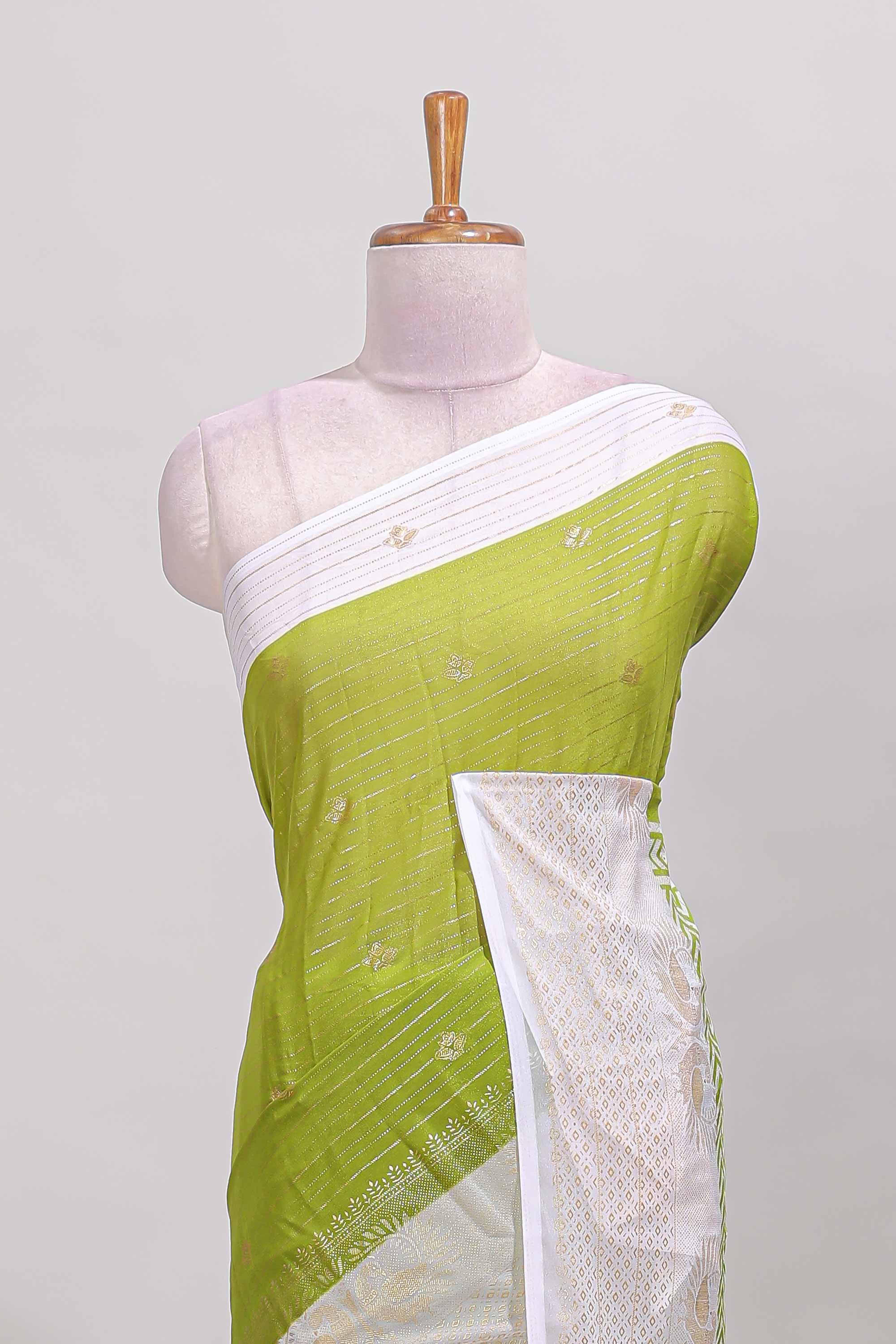 Green zari striped dola silk saree with contrast zari border and blouse