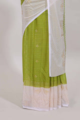 Green zari striped dola silk saree with contrast zari border and blouse