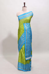 Lime green zari striped saree in dola silk with contrast woven border and blouse