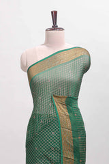 Green checked zari butta dola silk saree with self zari border and matching blouse