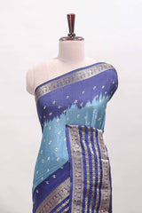 Turquoise blue unique buttas dola silk saree with contrast zari border and blouse