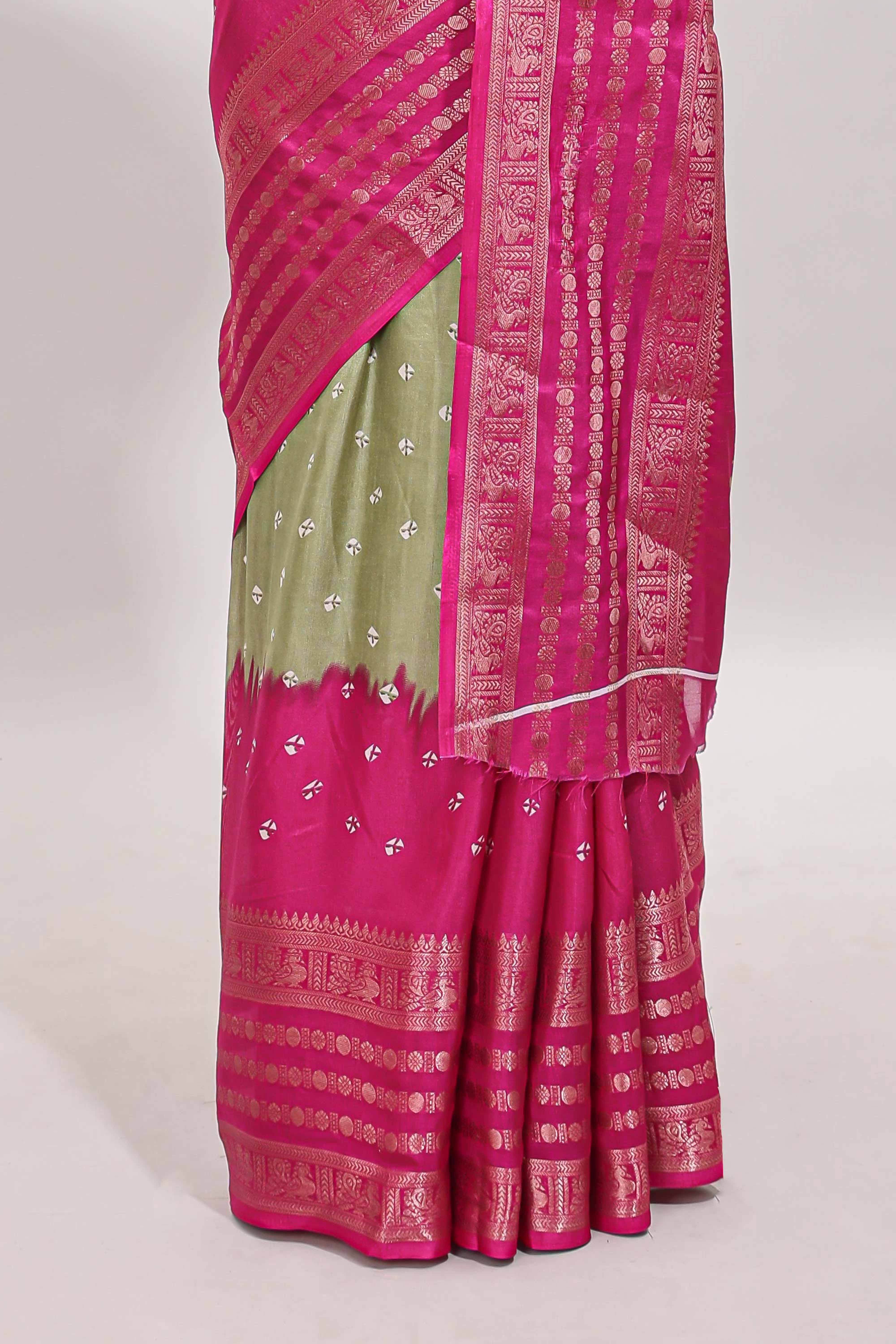 Green unique buttas dola silk saree with contrast zari border and blouse