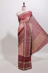 Pink unique buttas dola silk saree with contrast dark green zari border and blouse
