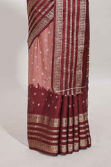 Pink unique buttas dola silk saree with contrast dark green zari border and blouse