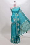 Turquoise green checked elephant motifs dola silk saree with self zari border and striped pallu