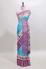 Blue checked dola silk saree with contrast zari border and blouse
