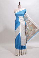 Blue zari striped dola silk saree withcontrast zari border and printed blouse