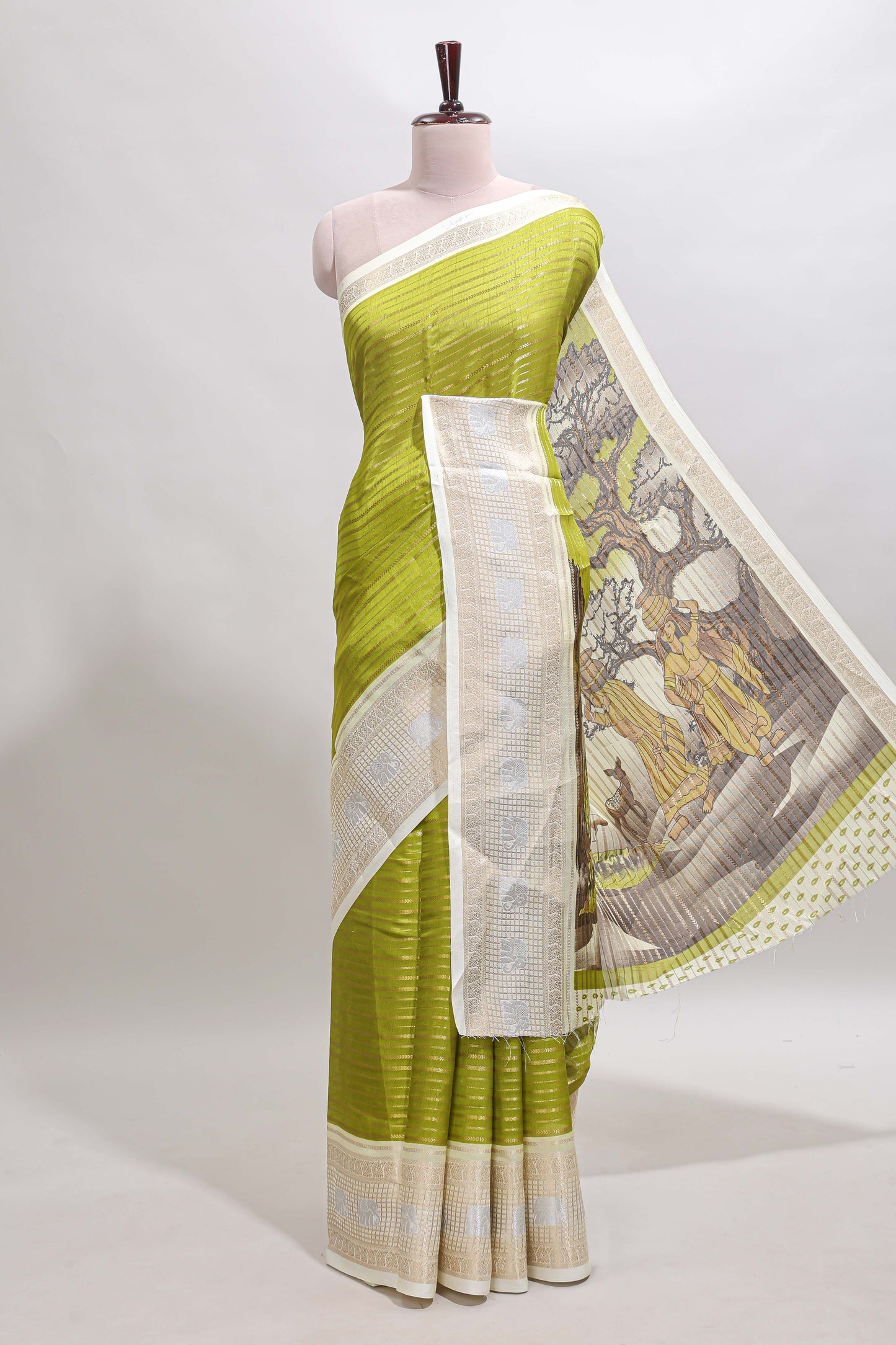 Green zari striped dola silk saree with contrast zari border and printed blouse