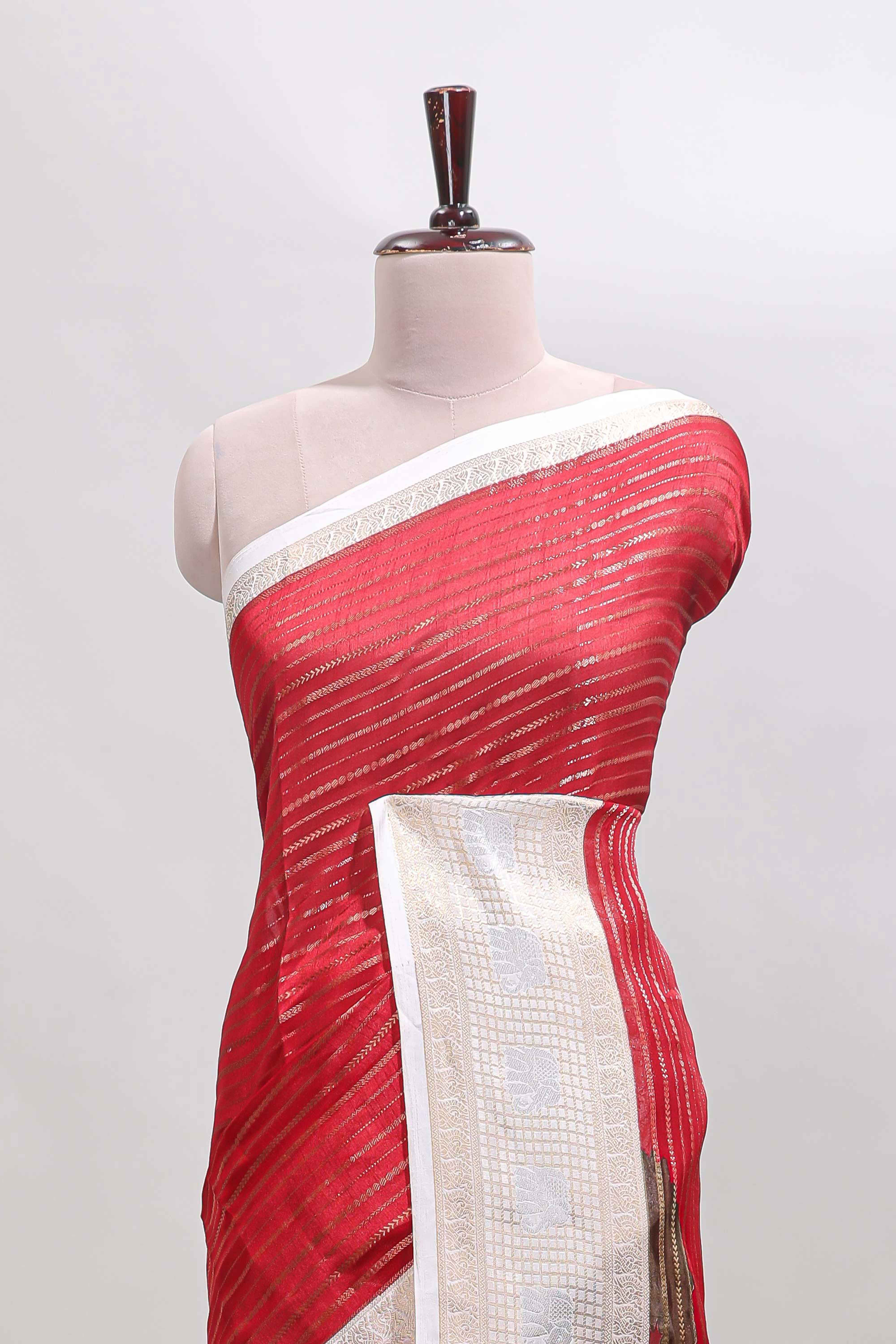 Red zari striped dola silk saree withcontrast zari border and printed blouse