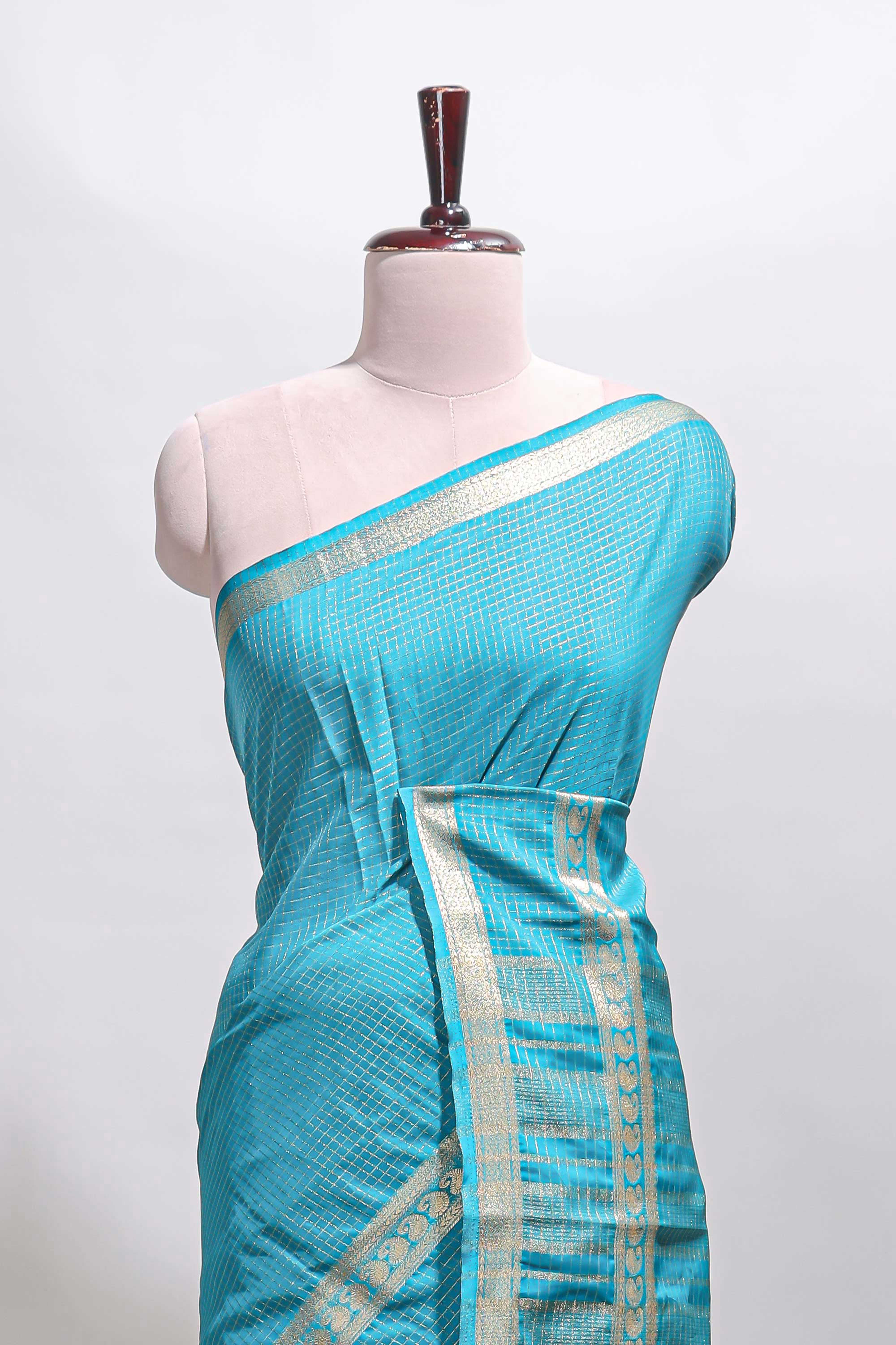 Blue checked dola silk saree with self zari border and matching striped pallu