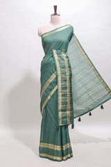 Green checked dola silk saree with self zari border and matching striped pallu