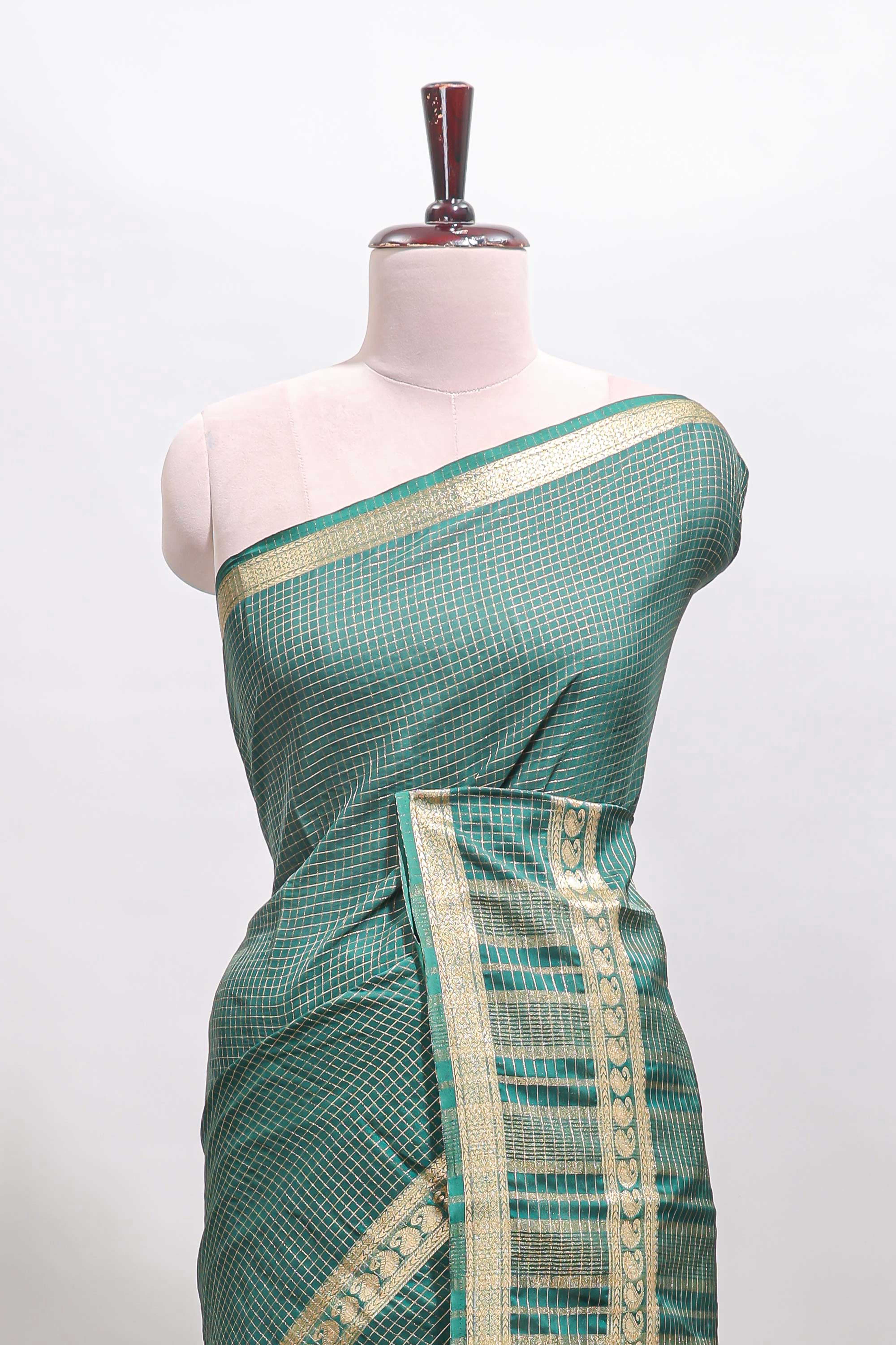 Green checked dola silk saree with self zari border and matching striped pallu