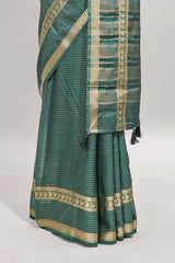 Green checked dola silk saree with self zari border and matching striped pallu