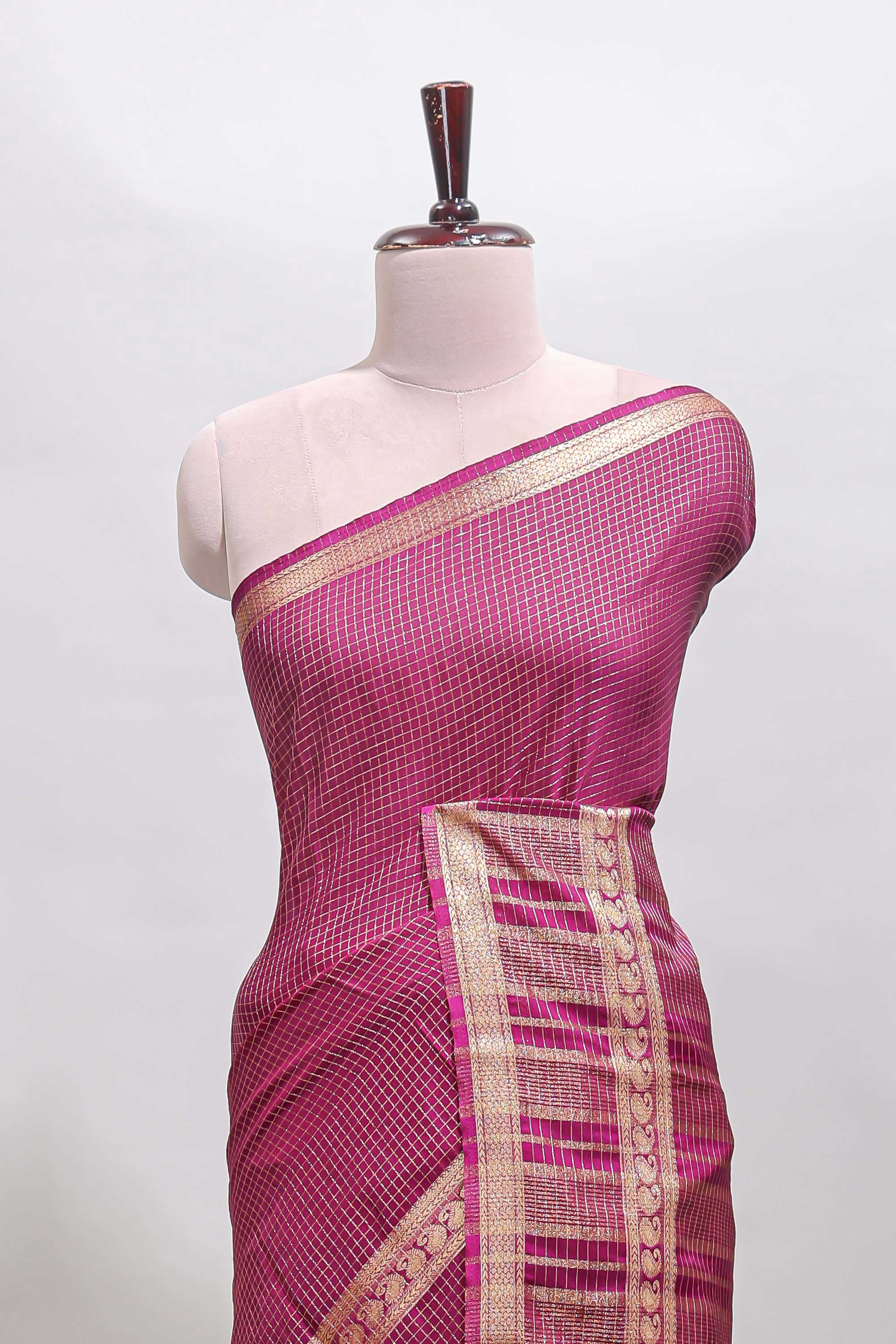 Magenta checked dola silk saree with self zari border and matching striped pallu