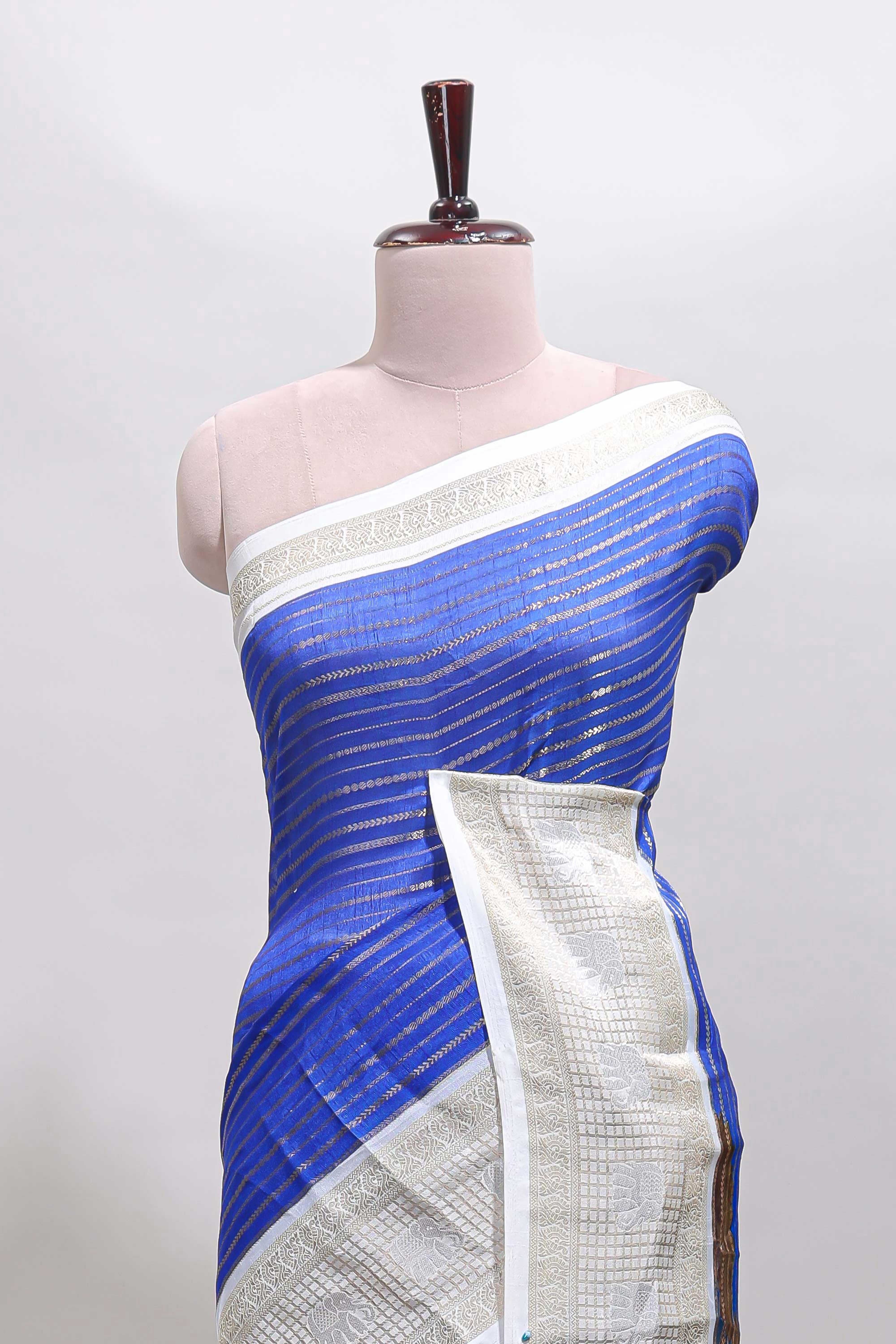 Blue striped dola silk saree with contrast zari border and kalamkari style pallu