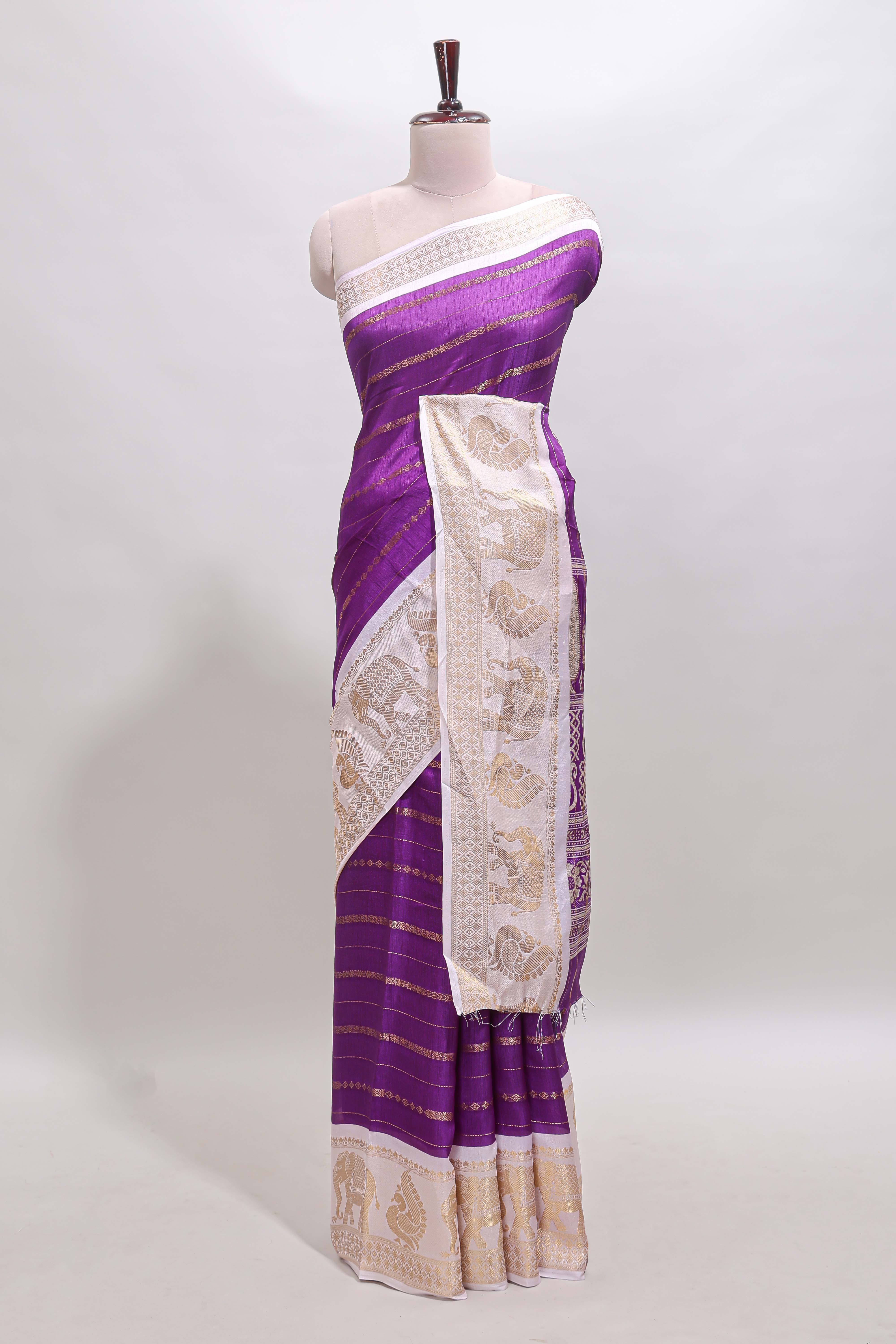 Violet striped dola silk saree with contrast zari border and kalamkari style pallu
