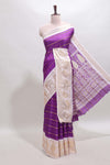 Violet striped dola silk saree with contrast zari border and kalamkari style pallu