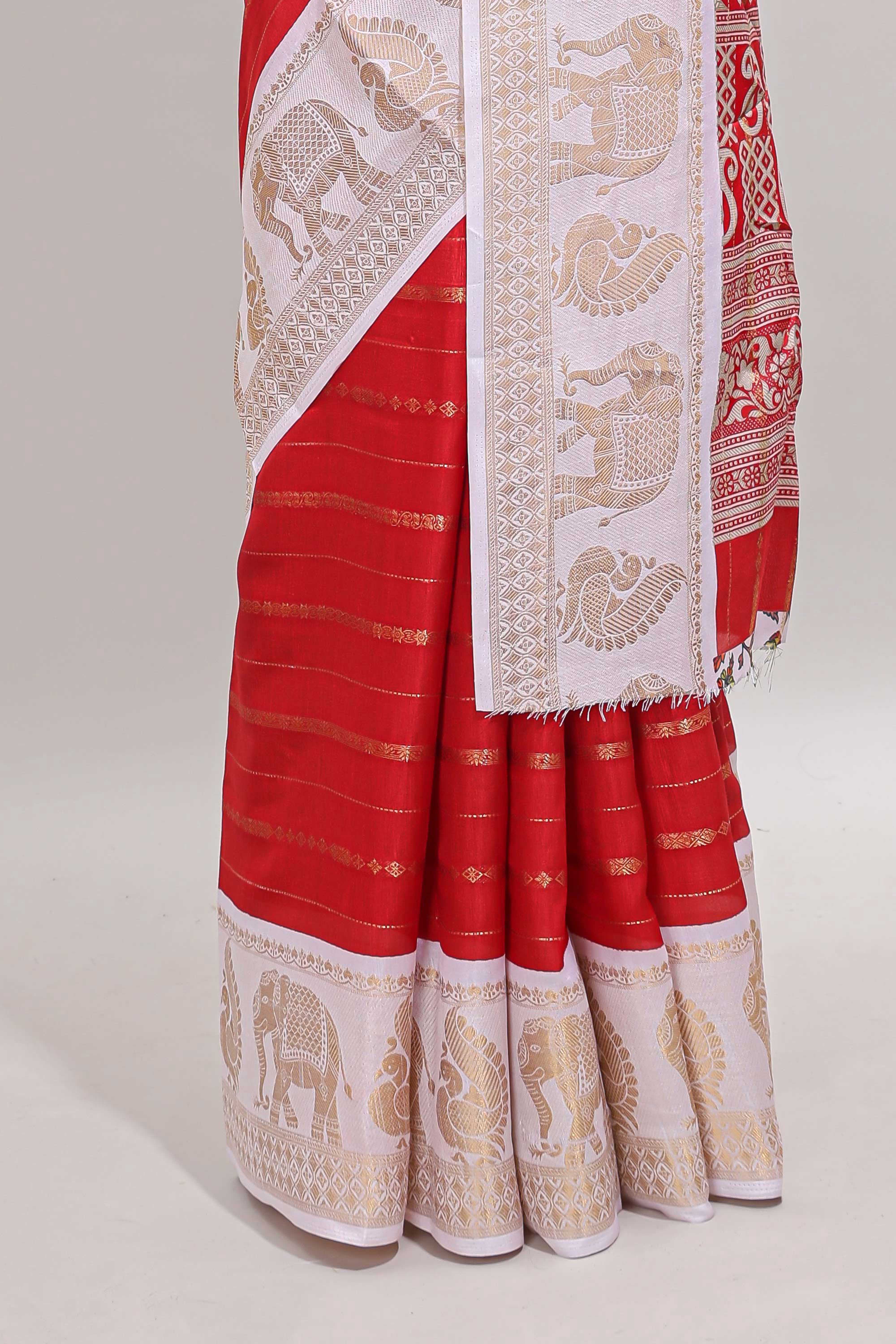Red striped dola silk saree with contrast zari border and kalamkari style pallu
