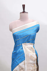 Peacock blue striped dola silk saree with contrast zari border and kalamkari style pallu