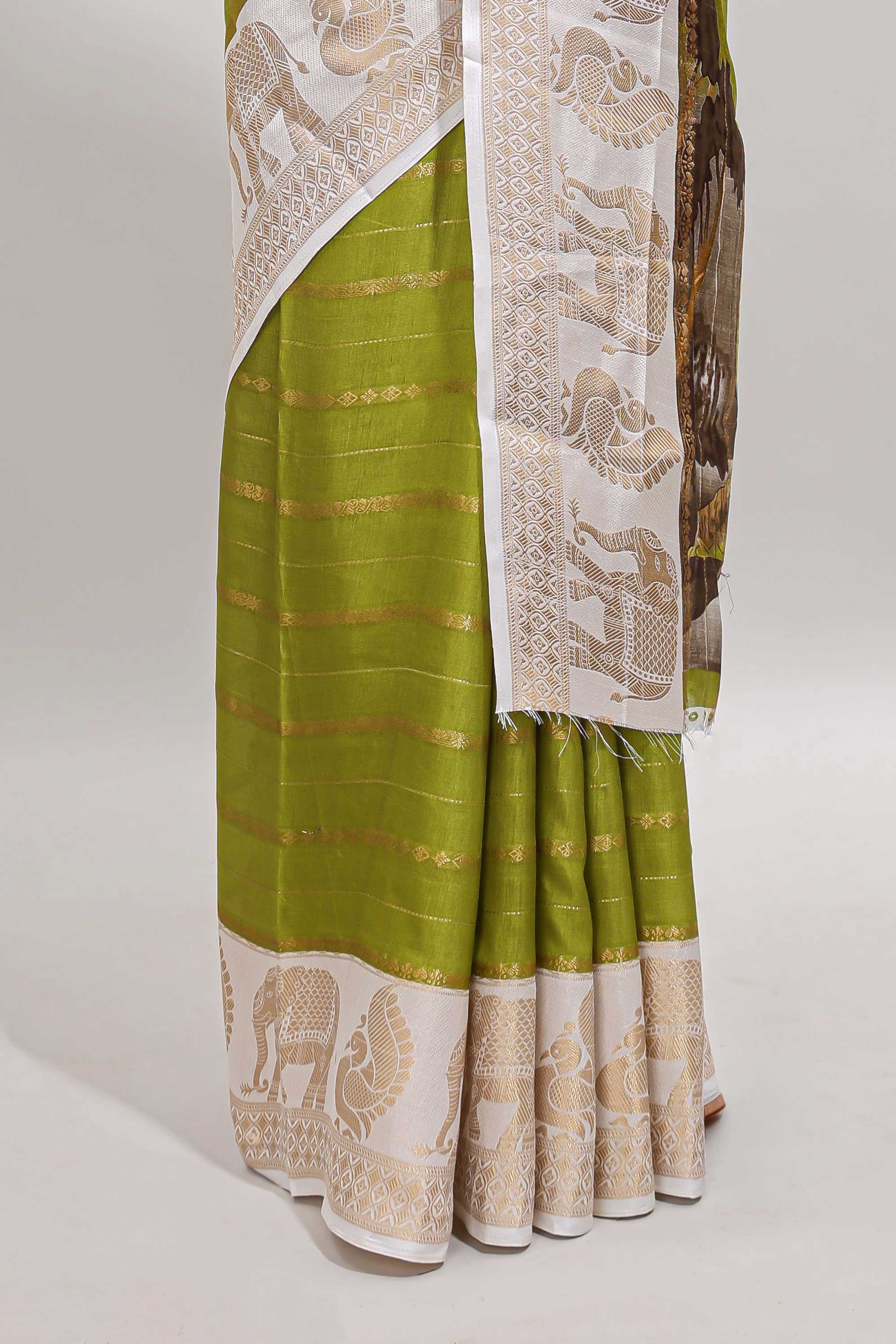 Green striped dola silk saree with contrast zari border and kalamkari style pallu
