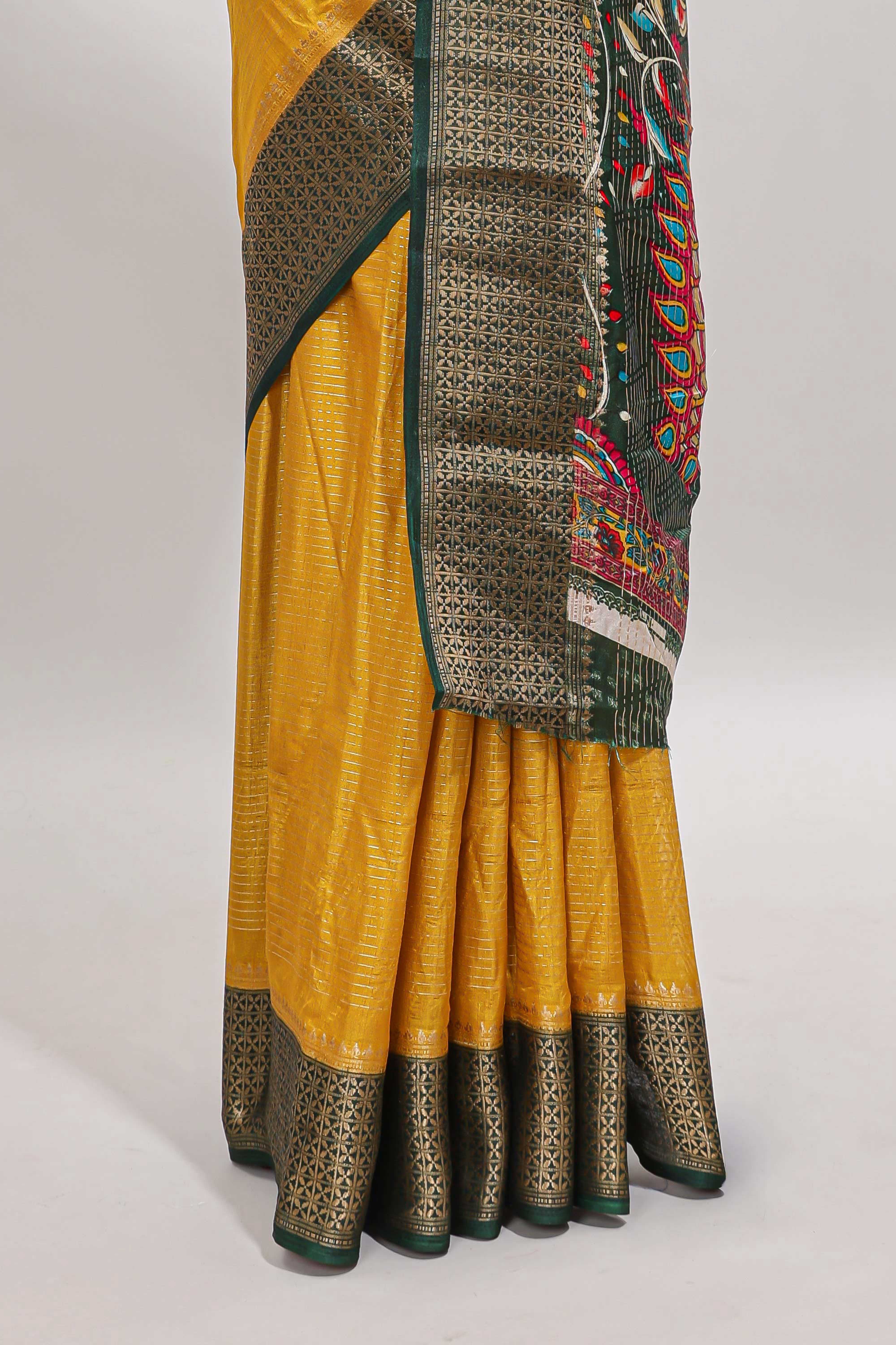 Mustard striped dola silk saree with contrast zari border and peacock & floral design pallu