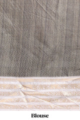 Grey geometric design dola silk saree withcontrast zari border and matching blouse